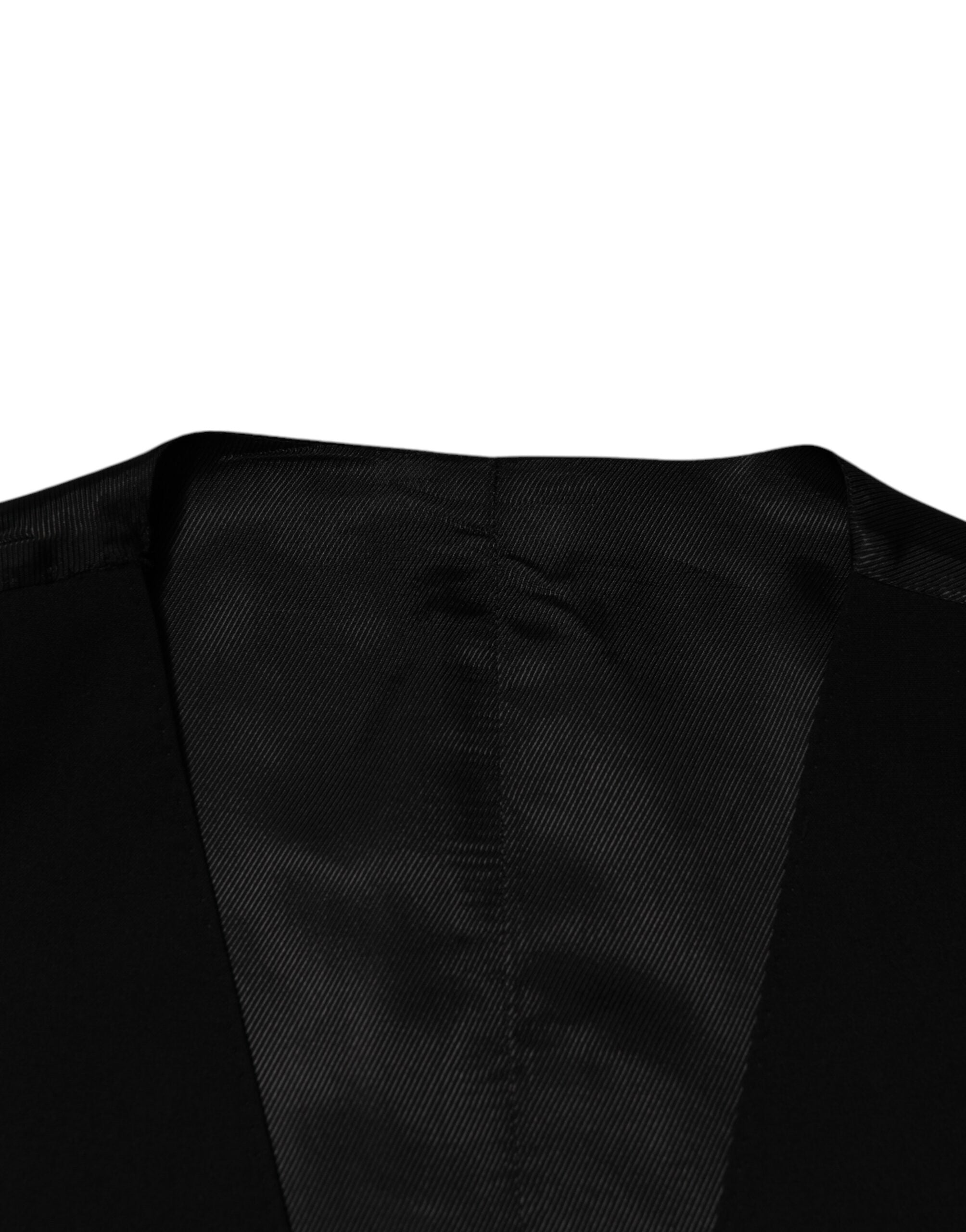 Elevate your formal wardrobe with the Dolce & Gabbana Black Wool Dress Waistcoat Vest, crafted from luxurious virgin wool for timeless sophistication and unparalleled elegance.