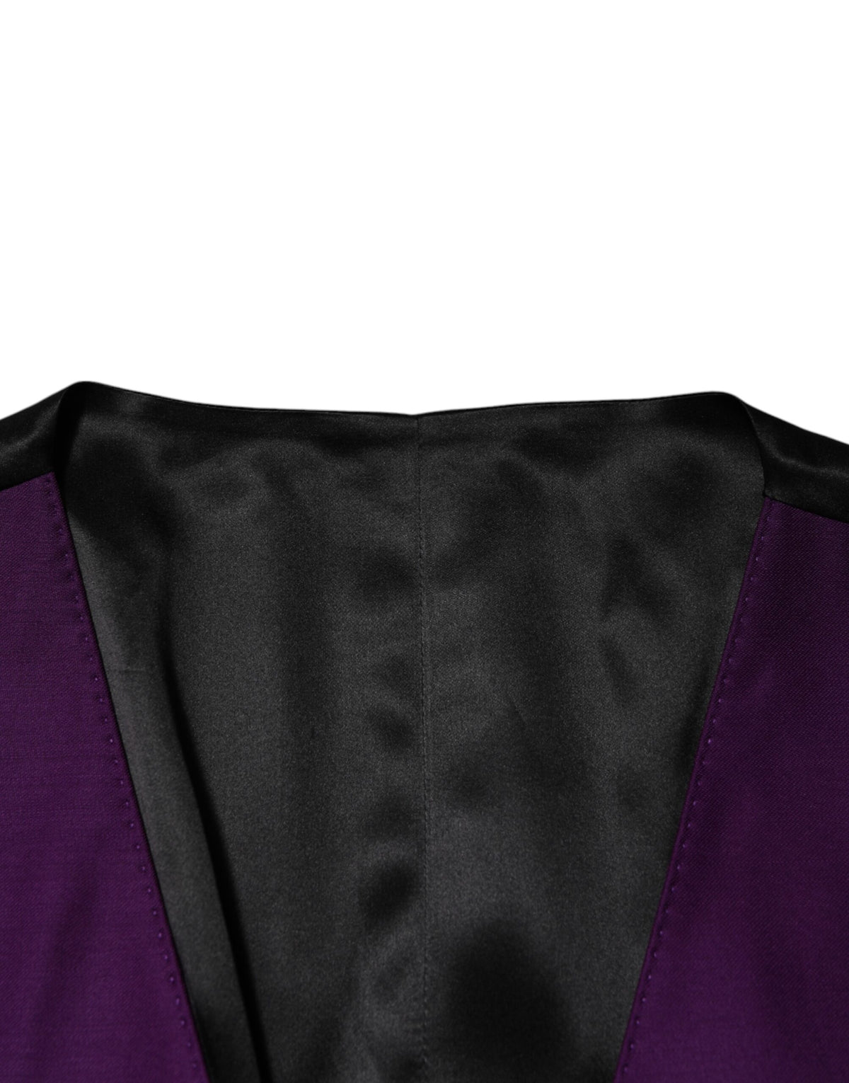 Elevate your formal wardrobe with the Dolce & Gabbana Purple Wool Dress Waistcoat Vest, a luxurious blend of virgin wool and silk, embodying Italian craftsmanship and timeless elegance.