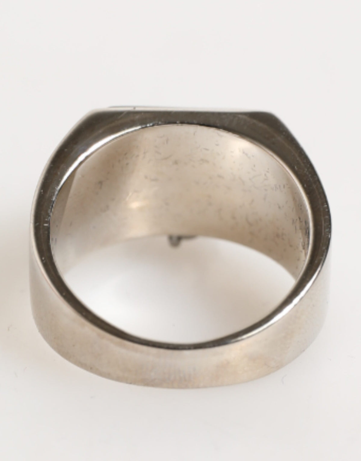 Discover the Dolce & Gabbana Silver Tone Pyramid DG Logo Ring, a luxurious statement crafted from real brass, embodying Italian artistry and timeless elegance.