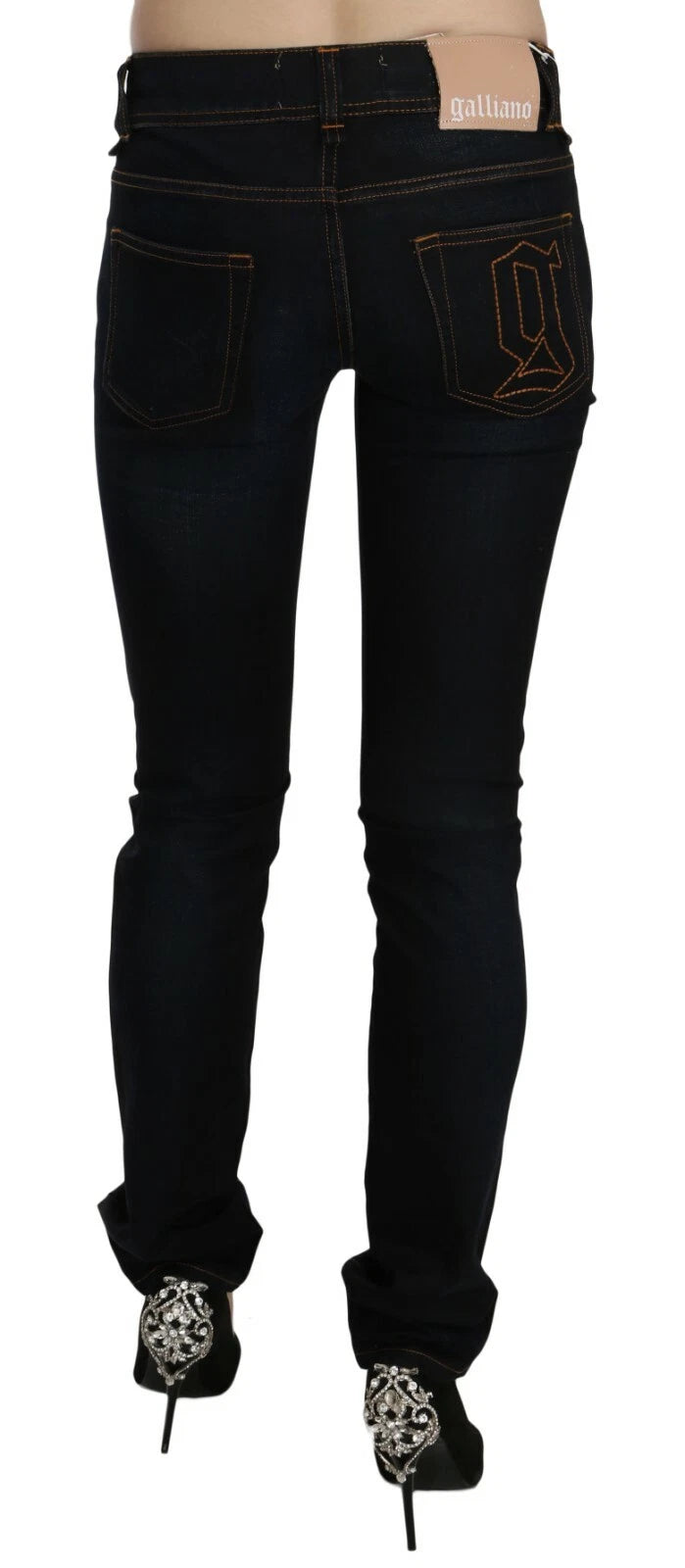Indulge in the exquisite allure of John Galliano's Dark Blue Mid Waist Slim Fit Denim, crafted from a luxurious cotton blend, elevating your style with every wear.