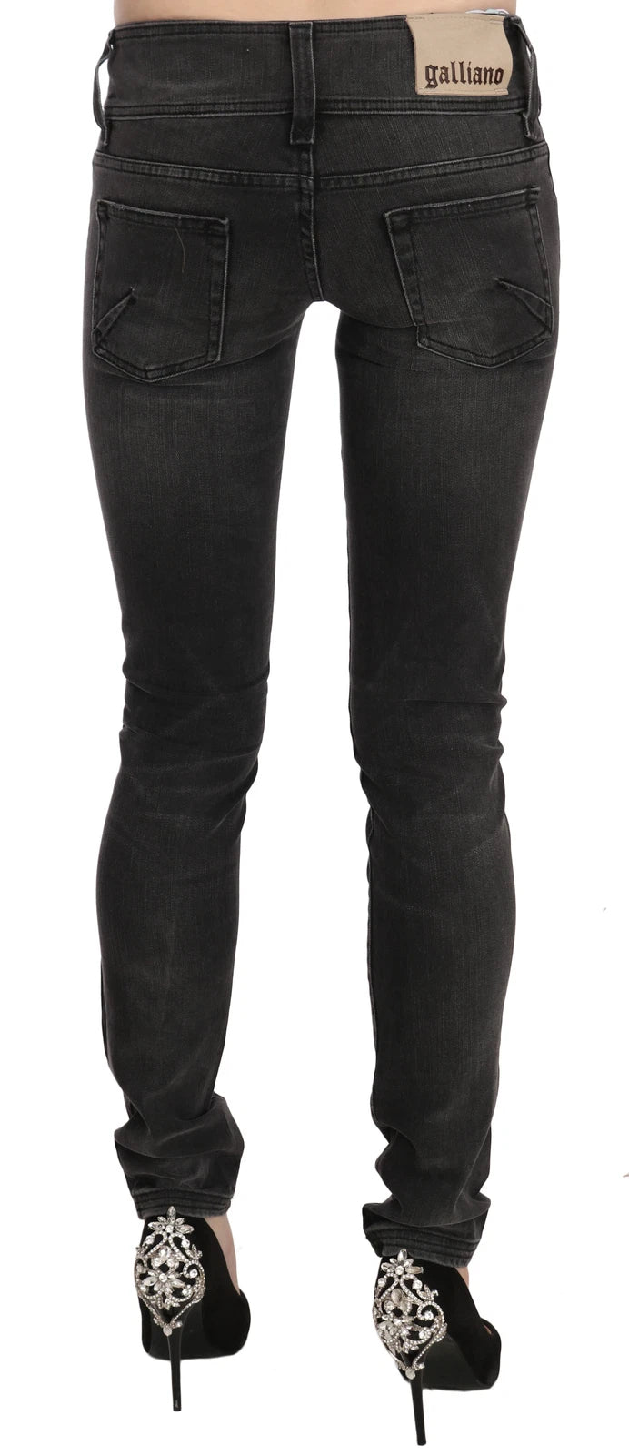 Experience the allure of John Galliano's Black Washed Low Waist Slim Fit Skinny Jeans, where exquisite Italian craftsmanship meets timeless elegance, perfect for the discerning individual.