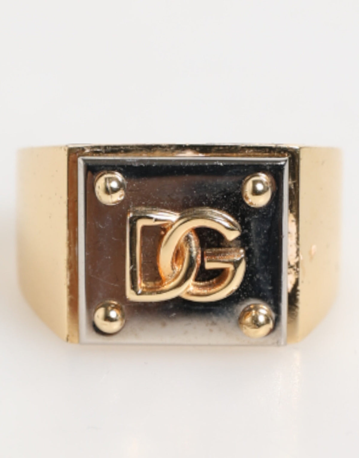 Elevate your style with the Dolce & Gabbana Gold Tone Brass Signet Ring, a symbol of refined craftsmanship and modern elegance, perfect for those who embody luxury.