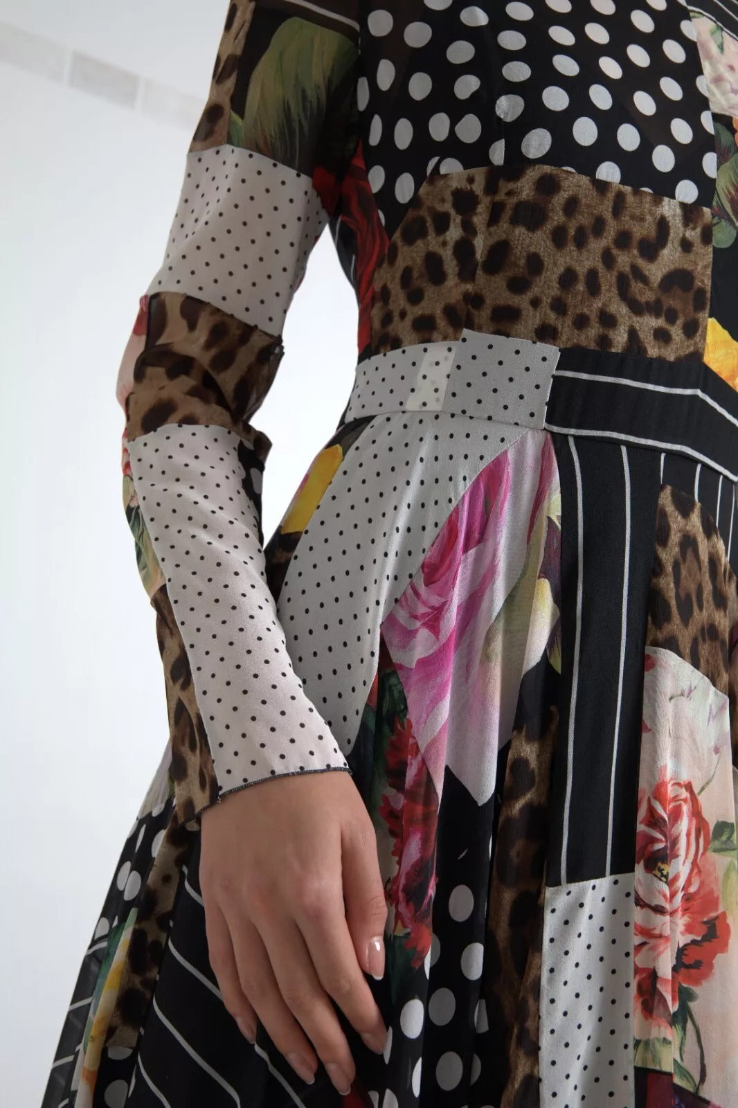 Indulge in the exquisite artistry of the Dolce & Gabbana Multicolor Patchwork Floral Leopard Dress, where luxurious silk meets captivating design, perfect for the discerning fashion lover.