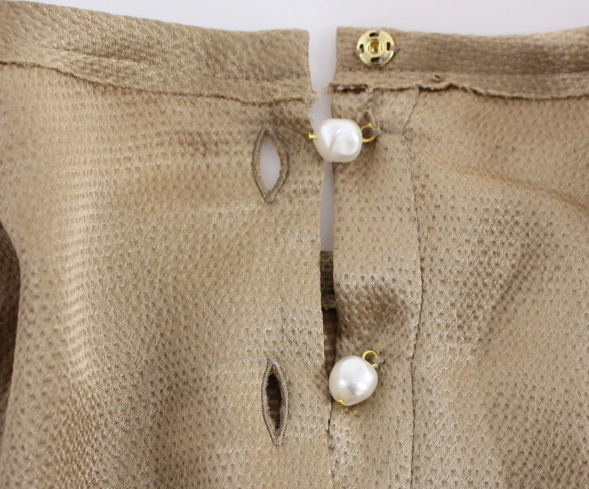 Indulge in the exquisite Dolce & Gabbana Gold SPECIAL Piece Runway Crystal Blouse, a testament to Italian craftsmanship and luxury, adorned with shimmering crystals for an unforgettable allure.