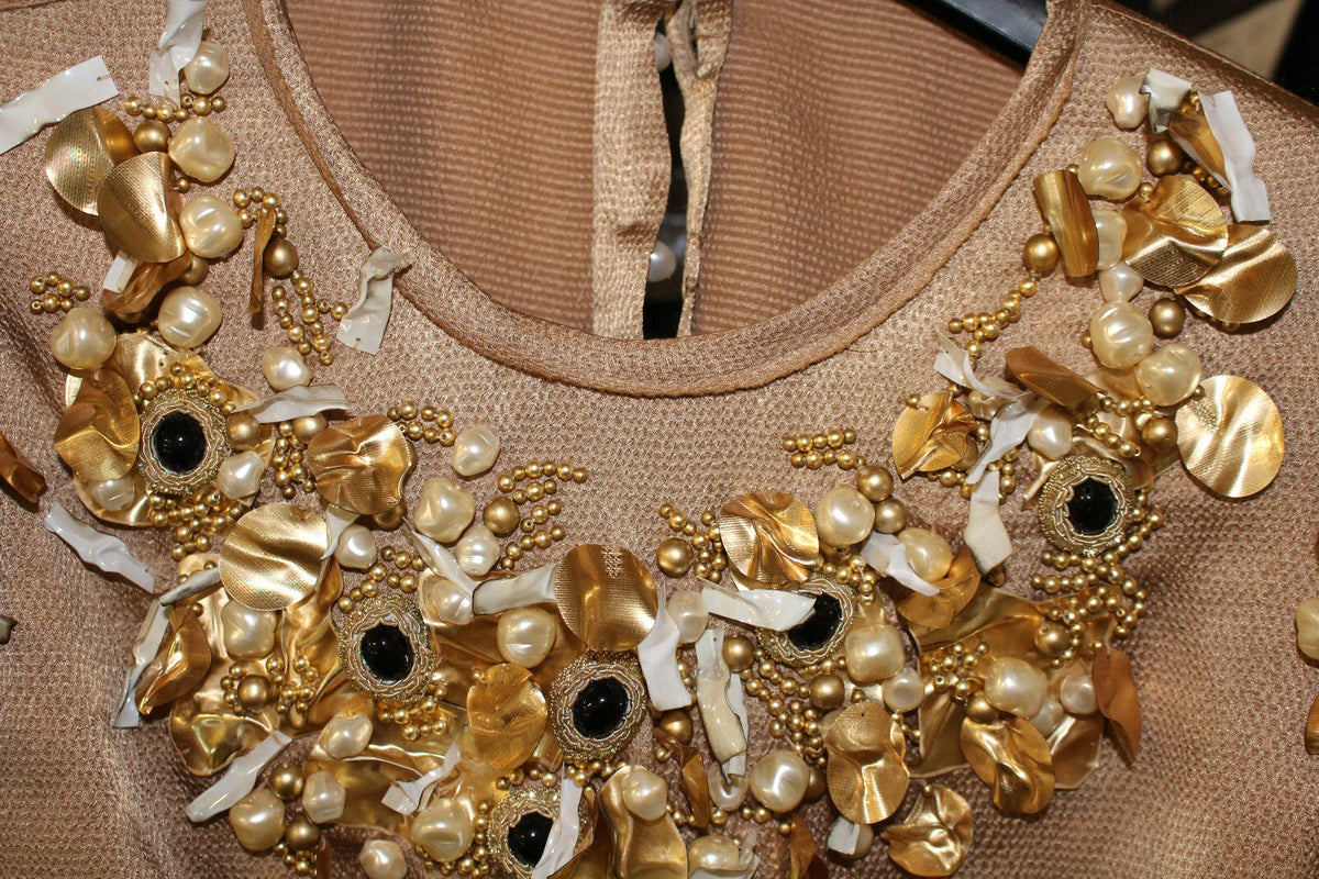 Indulge in the exquisite Dolce & Gabbana Gold SPECIAL Piece Runway Crystal Blouse, a luxurious testament to Italian craftsmanship, adorned with shimmering crystals and pearls.