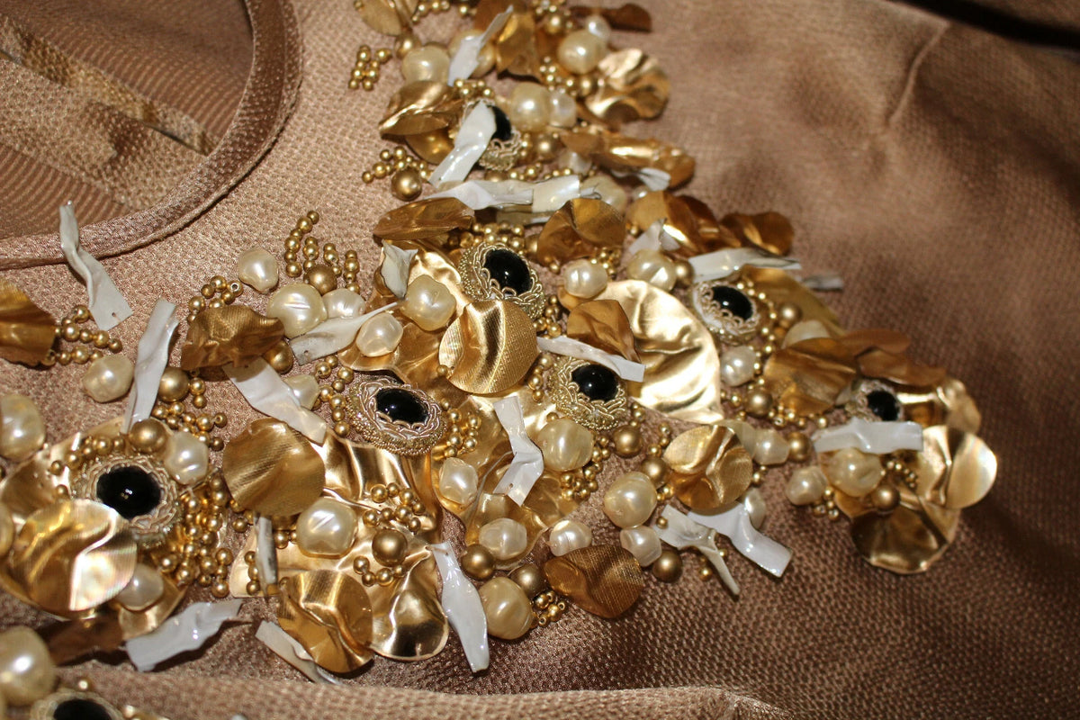 Indulge in the exquisite Dolce & Gabbana Gold SPECIAL Piece Runway Crystal Blouse, a luxurious blend of craftsmanship and elegance that captivates the senses.