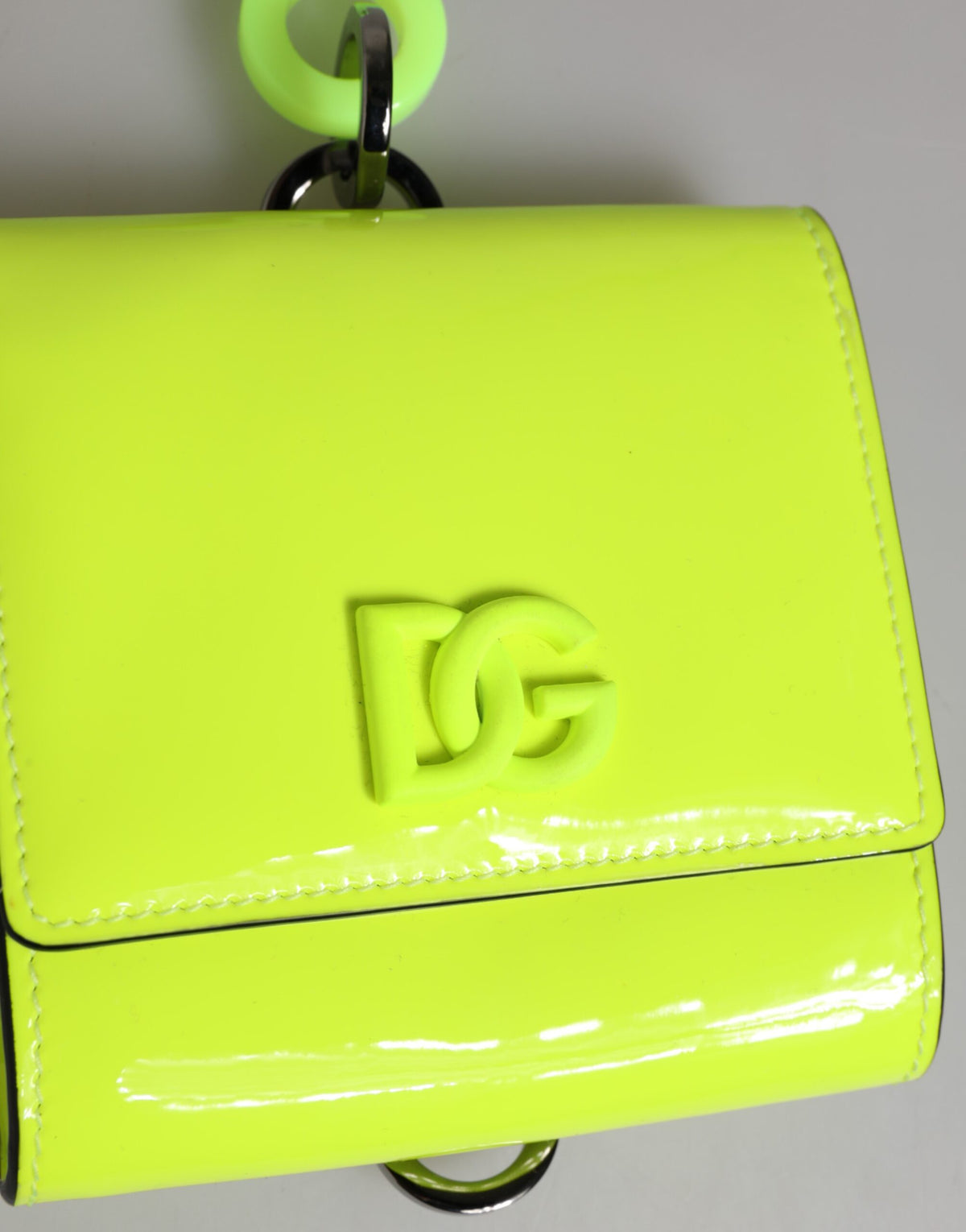 Indulge in the exquisite Dolce & Gabbana Yellow Green Bifold DG Logo Neck Strap Cardholder, a masterpiece of Italian craftsmanship in luxurious calf leather, perfect for the discerning individual.