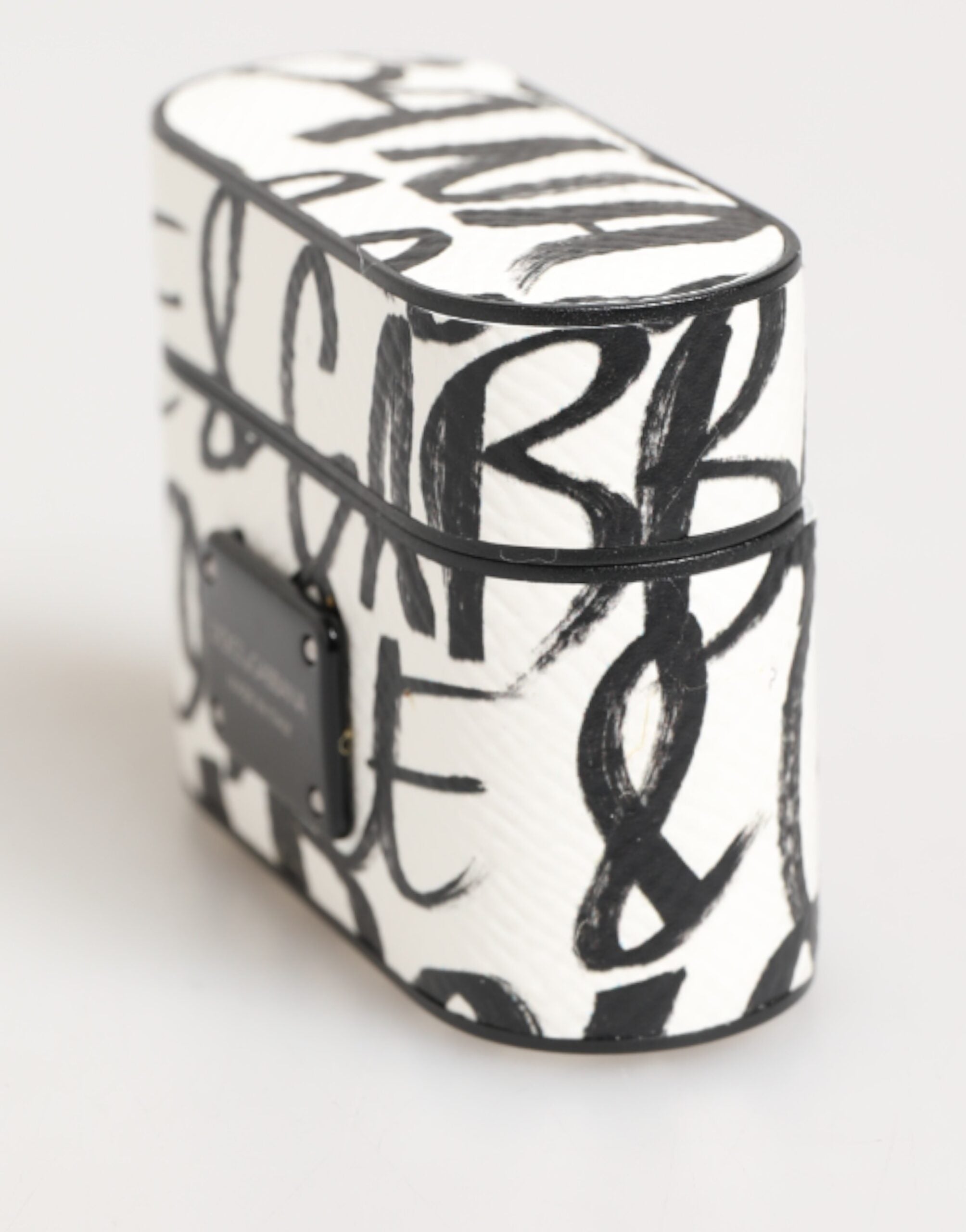 Elevate your style with the Dolce & Gabbana Black White Leather Monogram Print AirPods Case, a luxurious blend of premium leather and iconic design, perfect for the discerning individual.