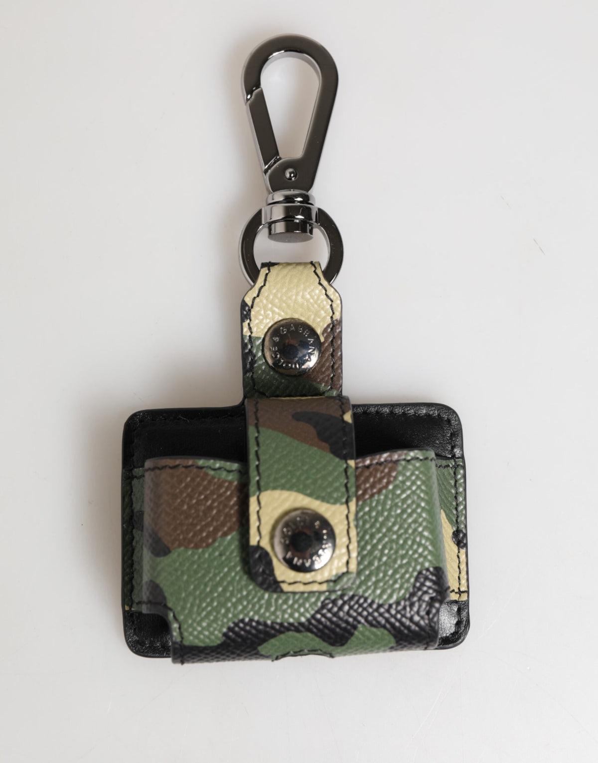 Indulge in the exquisite Dolce & Gabbana Multicolor Camouflage Leather Airpods Case, a luxurious blend of artistry and sophistication, perfect for the discerning individual.