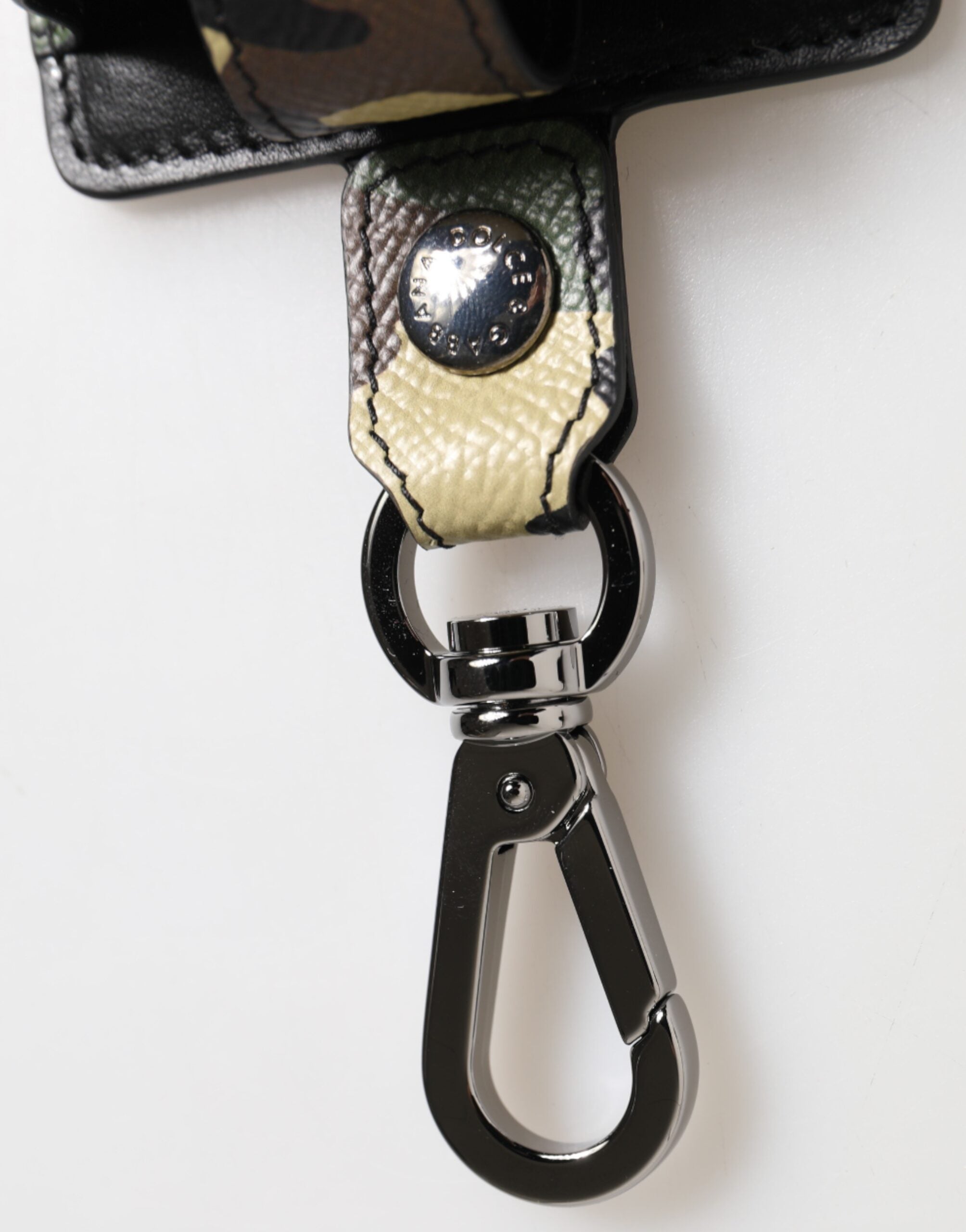 Elevate your style with the Dolce & Gabbana Multicolor Camouflage Leather Airpods Case, a luxurious blend of exquisite craftsmanship and bold design, perfect for the discerning individual.