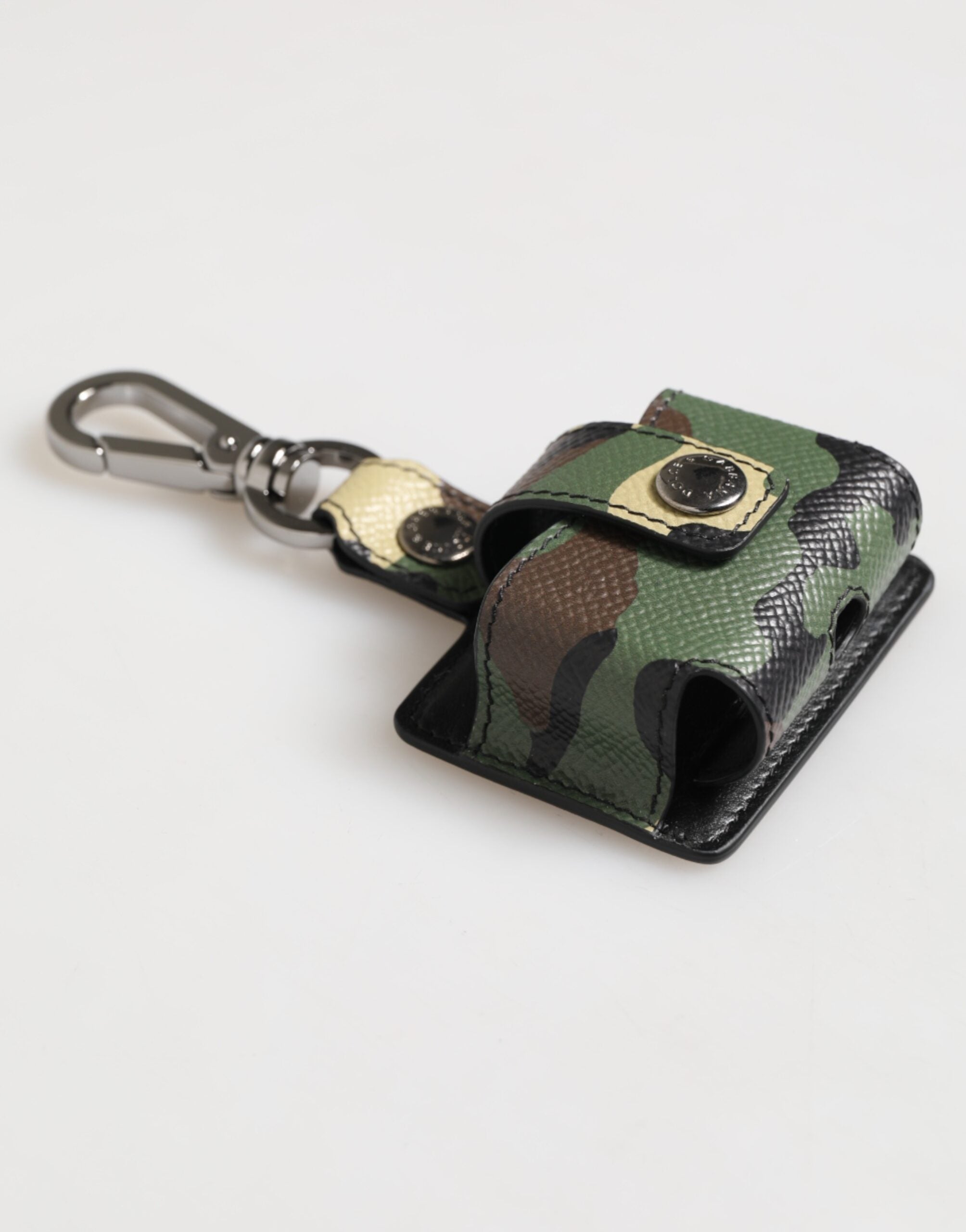 Elevate your style with the Dolce & Gabbana Multicolor Camouflage Leather Airpods Case, a luxurious blend of exquisite craftsmanship and bold individuality, meticulously crafted in Italy.
