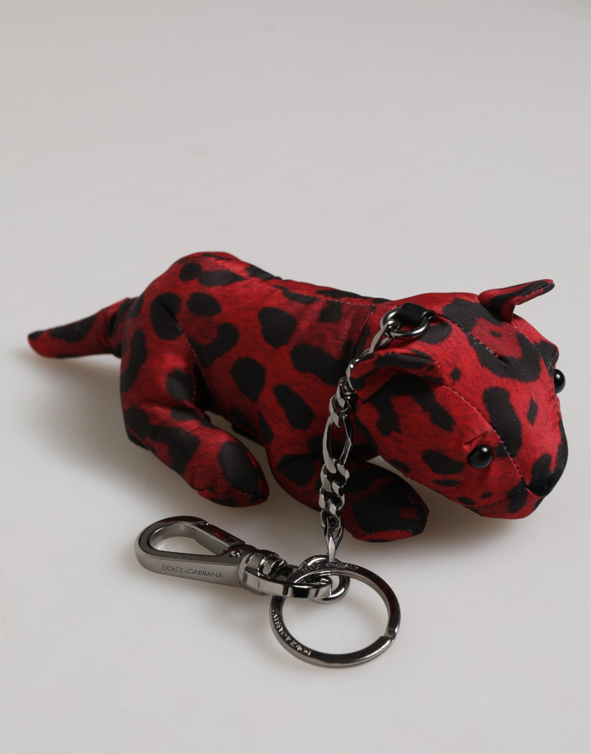Discover the Dolce & Gabbana Red Black Polyester Animal Silhouette Keychain, a luxurious statement piece that embodies exquisite craftsmanship and timeless elegance.
