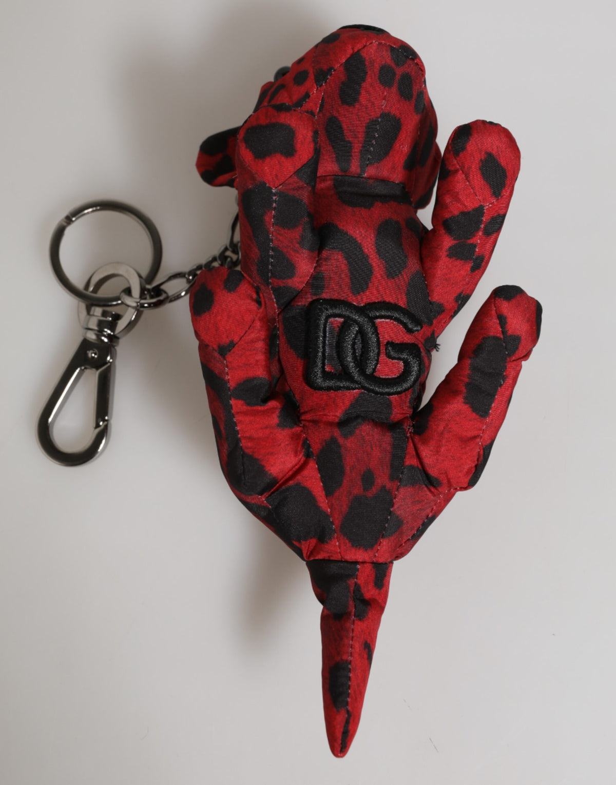 Elevate your style with the Dolce & Gabbana Red Black Polyester Animal Silhouette Keychain, a luxurious accessory that embodies exquisite craftsmanship and timeless elegance.