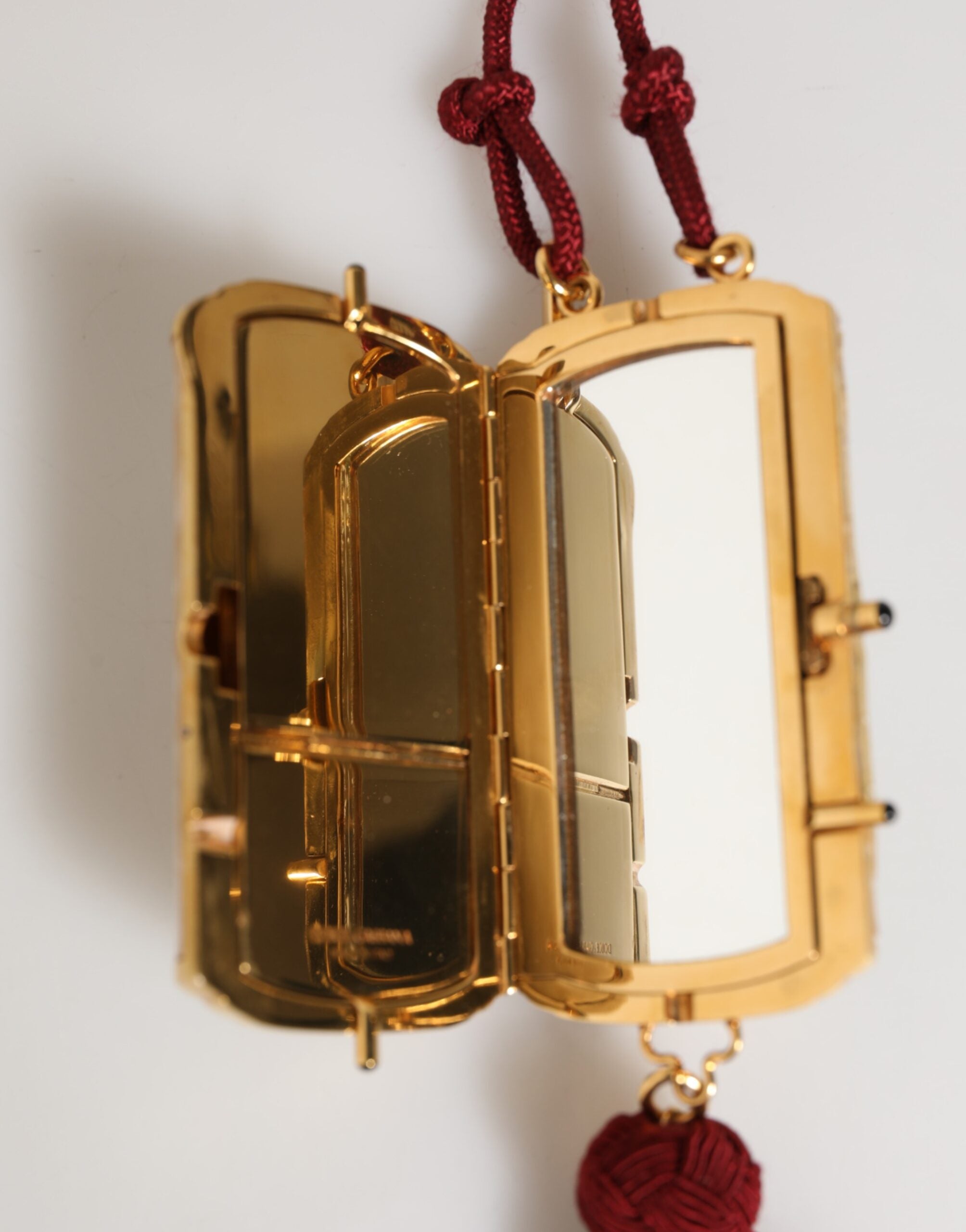 Elevate your style with the Dolce & Gabbana White Resin Gold Metal Crossbody Mini Purse, a luxurious statement piece crafted from exquisite materials, perfect for any occasion.