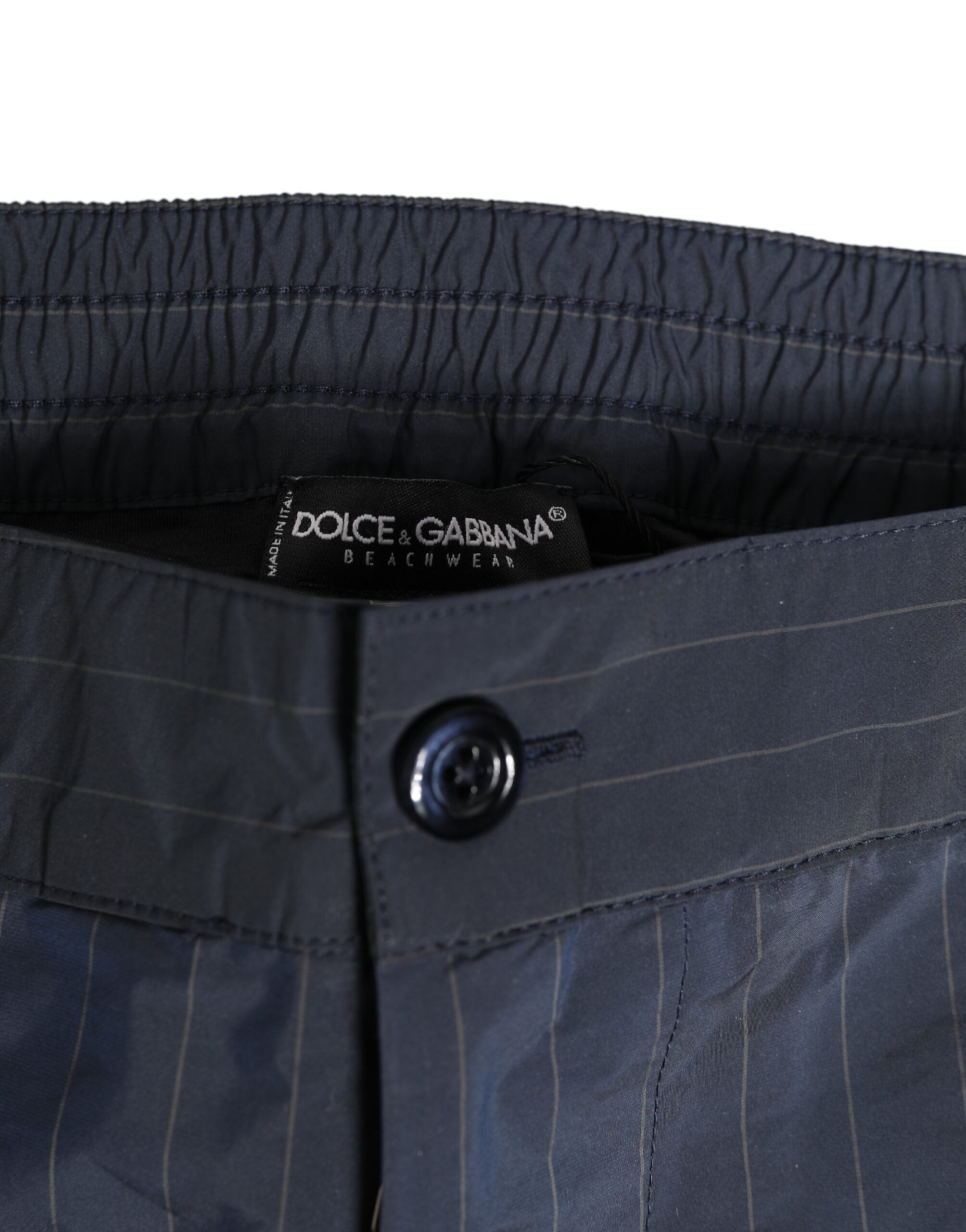 Discover the exquisite Dolce & Gabbana Navy Blue Polyester Pinstripe Men Shorts Swimwear, where luxurious craftsmanship meets timeless elegance for the discerning individual.