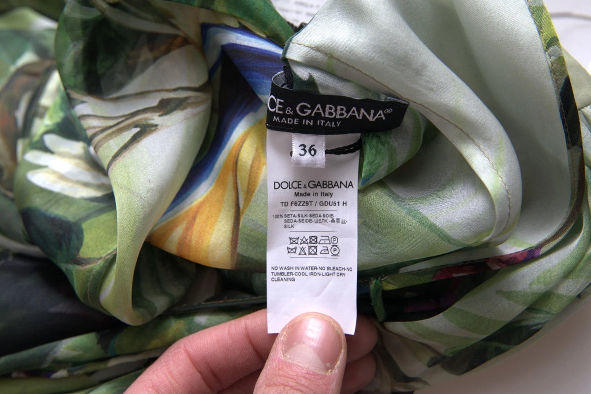 Indulge in the exquisite allure of the Dolce & Gabbana Multicolor Silk Jungle Print Maxi Dress, a masterpiece of Italian craftsmanship that embodies wild sophistication and timeless elegance.