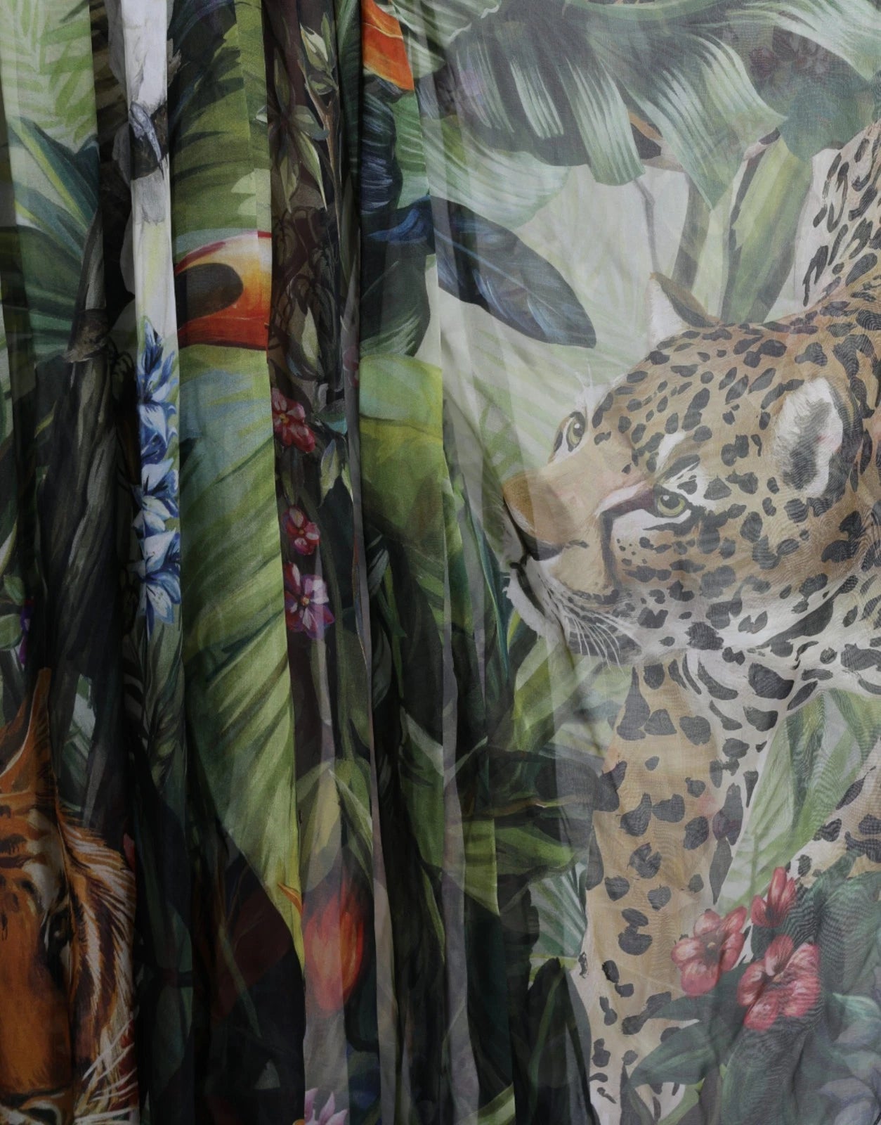 Elevate your wardrobe with the Dolce & Gabbana Multicolor Silk Jungle Print Maxi Dress, a luxurious expression of Italian craftsmanship that embodies wild sophistication and timeless elegance.