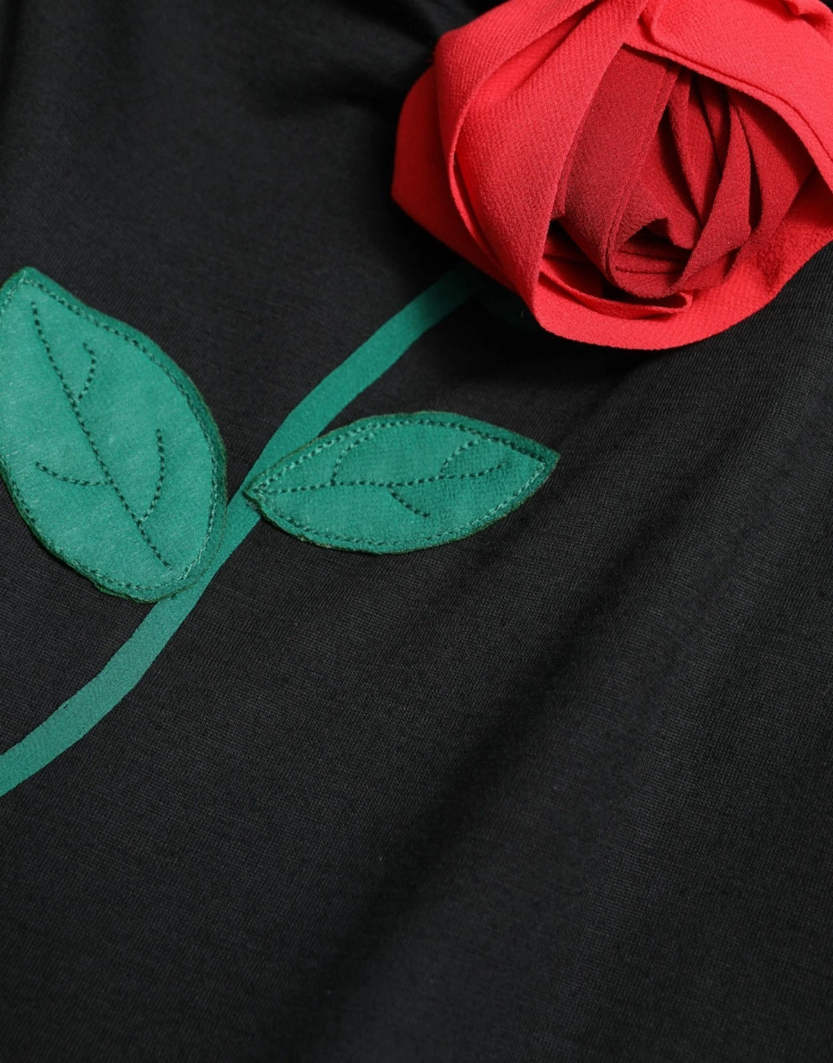 Indulge in the exquisite allure of the Dolce & Gabbana Black Wool Sleeveless Rose Applique Dress, where Italian craftsmanship meets luxurious elegance for unforgettable moments.