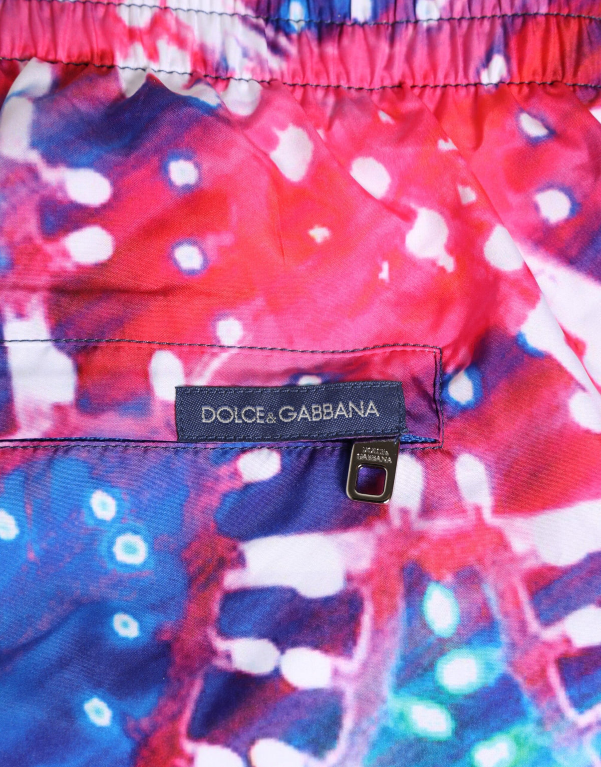 Indulge in the allure of Dolce & Gabbana's Multicolor Neon Print Swim Shorts, crafted from lightweight polyester for unmatched comfort and a statement of luxury.