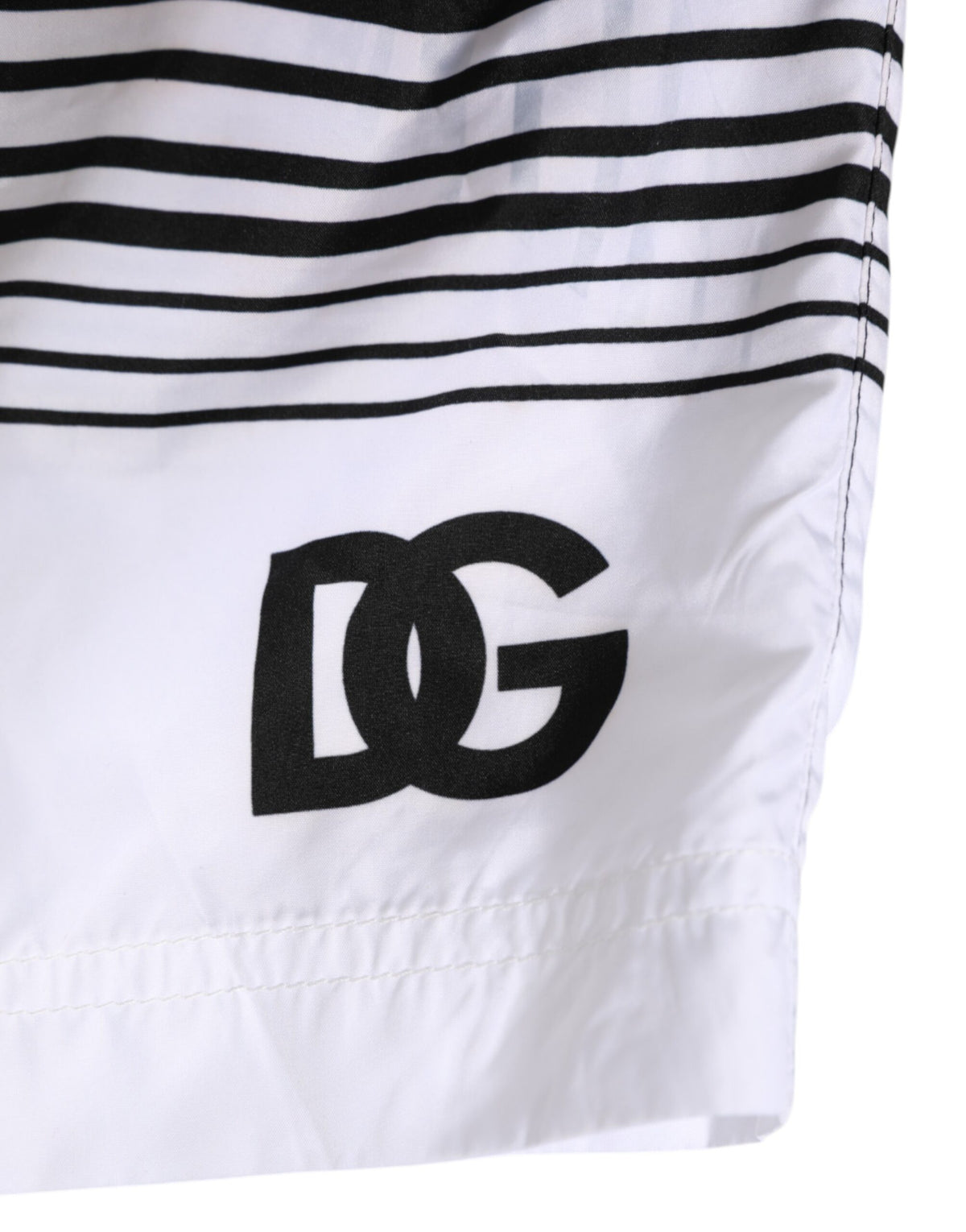 Elevate your beachwear collection with Dolce & Gabbana's Black White Striped DG Logo Swimwear, crafted from luxurious polyester for a sophisticated summer allure.
