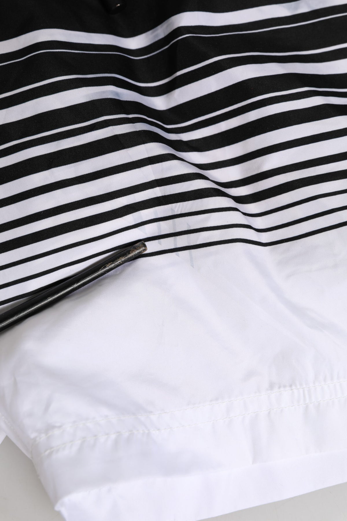 Elevate your beachwear collection with Dolce & Gabbana's exquisite Black White Striped DG Logo Men Short Swimwear, crafted from luxurious 100% polyester for ultimate comfort and style.
