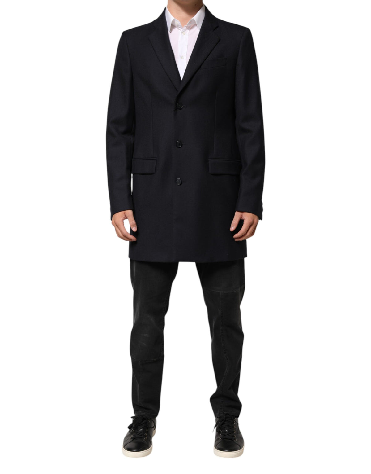 Elevate your style with the Dolce & Gabbana Dark Blue Wool Blazer, a masterpiece of Italian craftsmanship in luxurious virgin wool, perfect for the discerning individual.