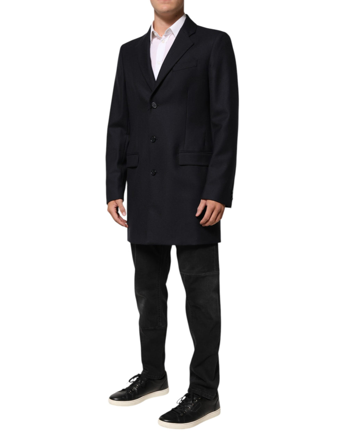 Elevate your style with the Dolce & Gabbana Dark Blue Wool Blazer, a masterpiece of Italian craftsmanship in luxurious virgin wool, perfect for the discerning individual.