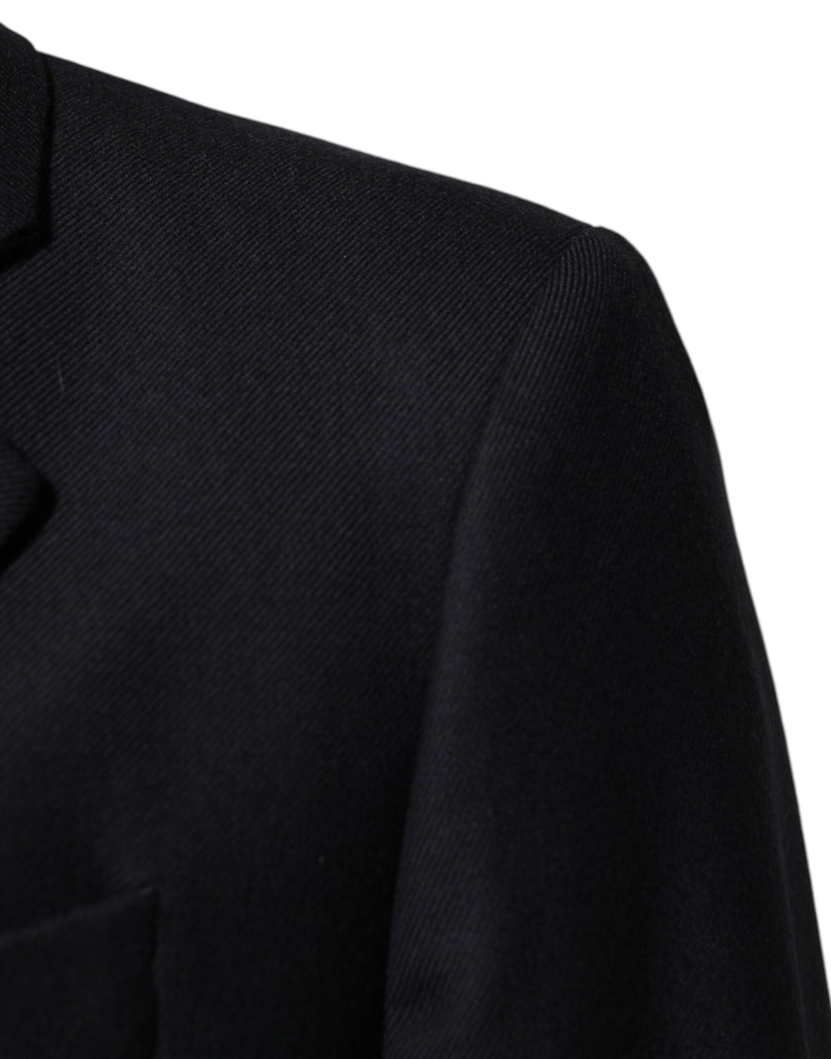 Elevate your wardrobe with the Dolce & Gabbana Dark Blue Wool Blazer, a masterpiece of Italian craftsmanship in luxurious virgin wool, perfect for the discerning individual.
