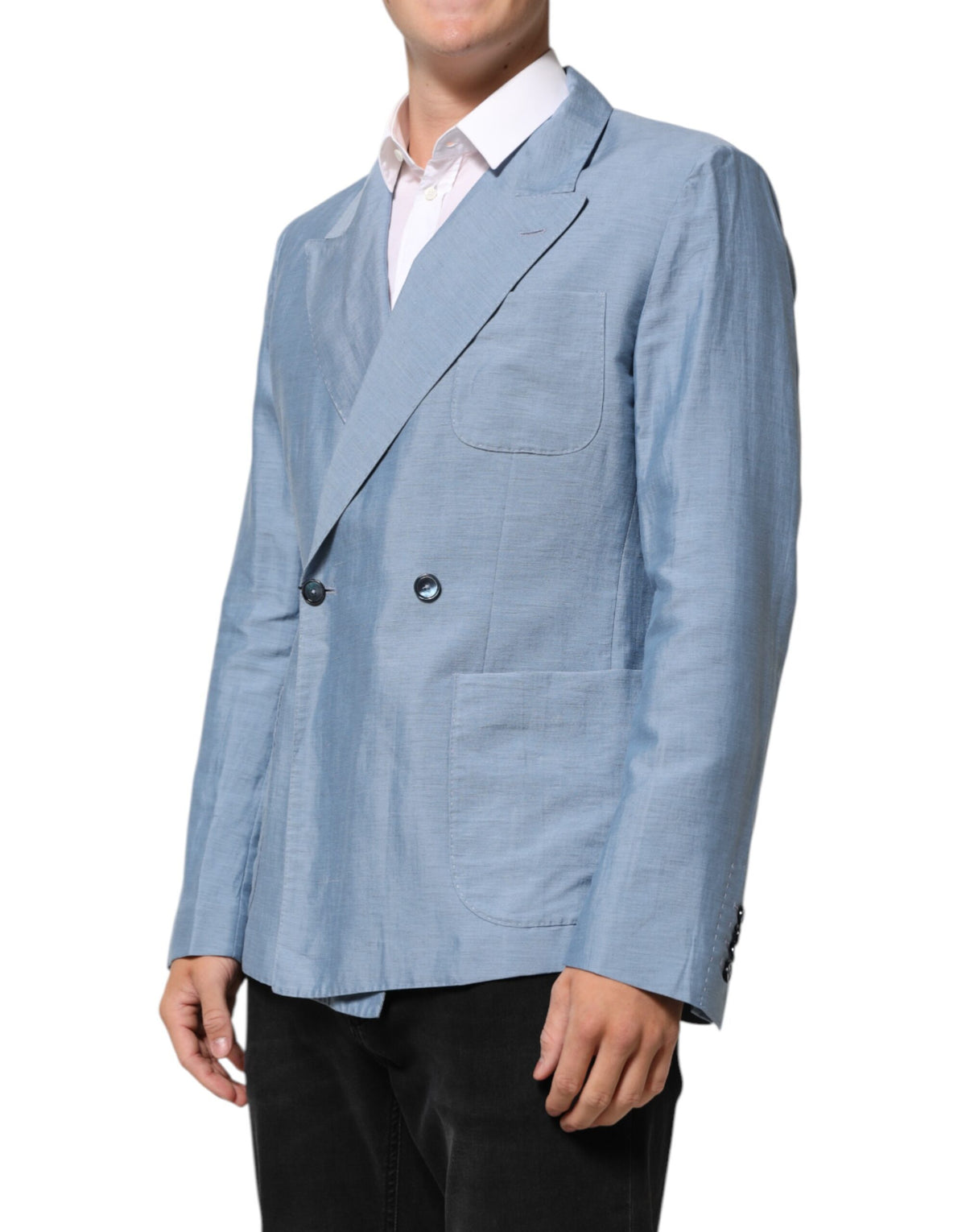 Elevate your wardrobe with the Dolce & Gabbana Light Blue Linen Double Breasted Blazer, a masterpiece of Italian craftsmanship that embodies timeless luxury and sophistication.