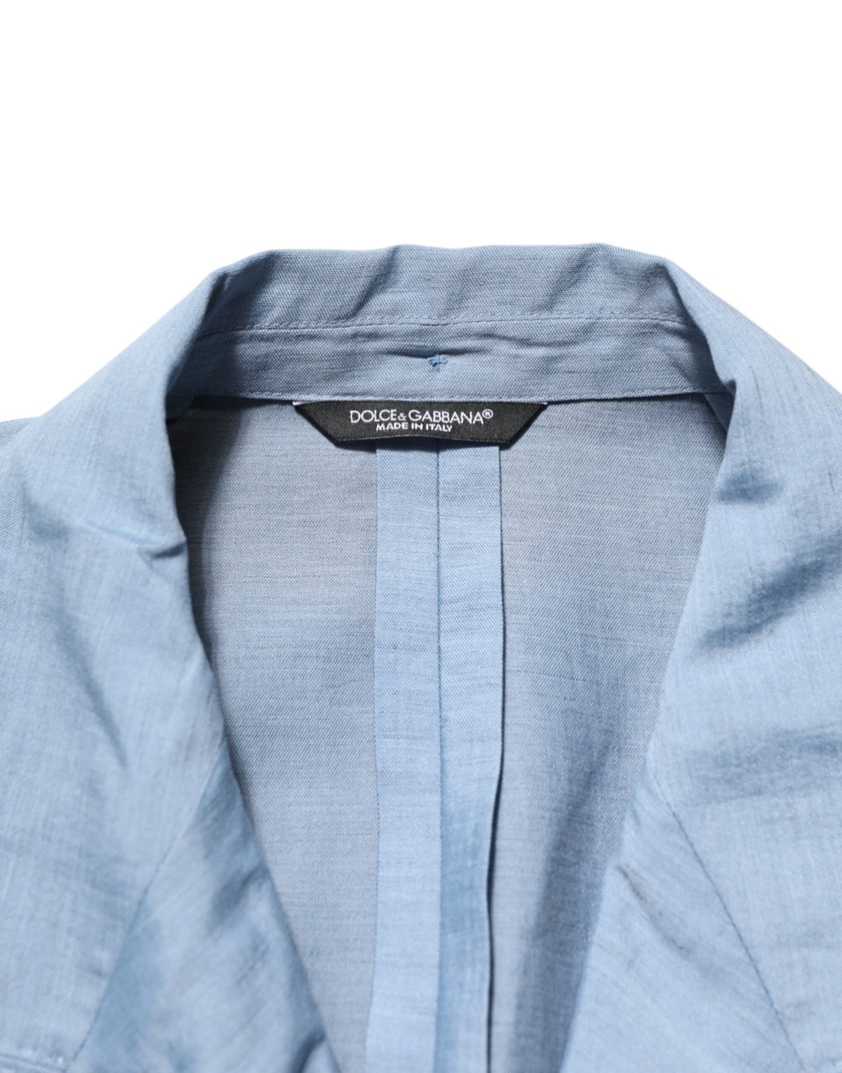 Elevate your wardrobe with the Dolce & Gabbana Light Blue Linen Double Breasted Blazer, a masterpiece of Italian craftsmanship that embodies timeless elegance and sophistication.
