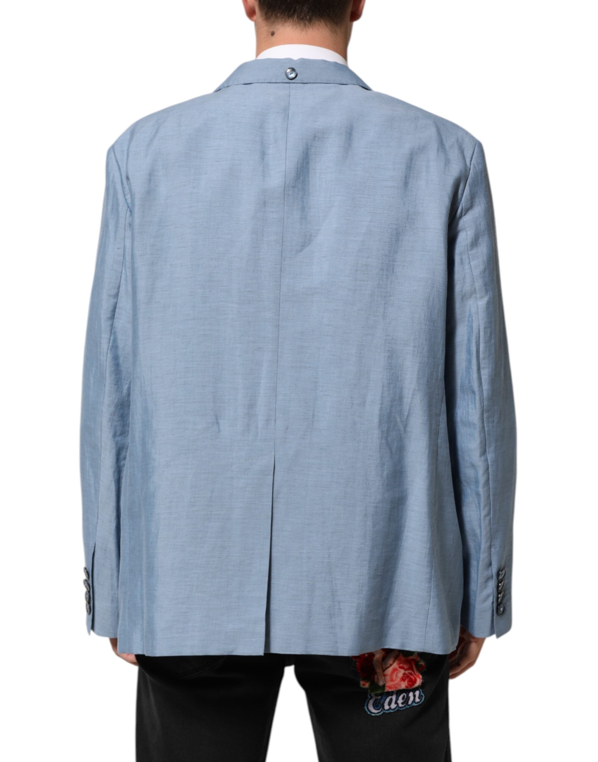 Indulge in the exquisite Dolce & Gabbana Light Blue Linen Double Breasted Blazer, a masterpiece of Italian craftsmanship that embodies timeless elegance and sophisticated allure.