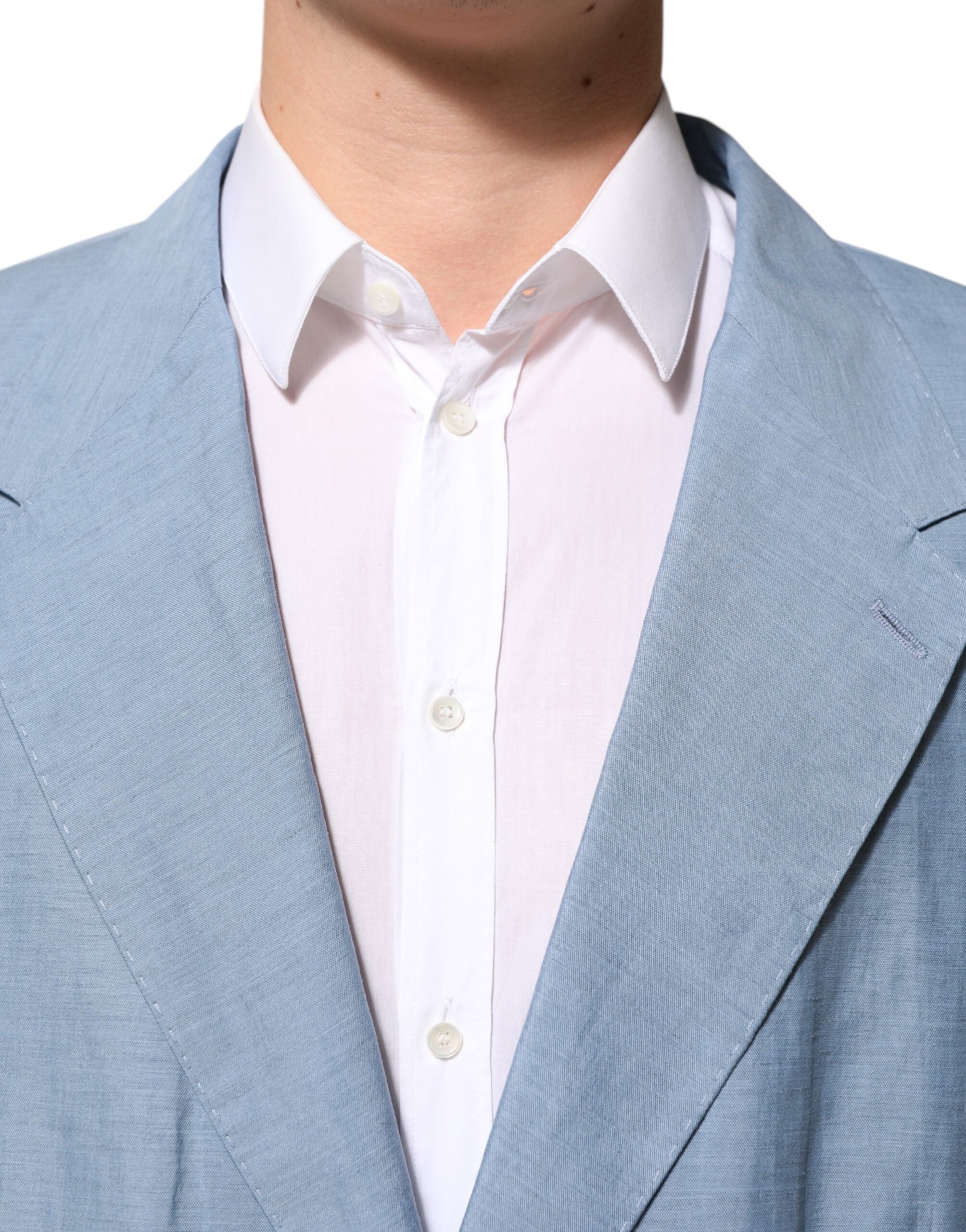Experience the allure of Dolce & Gabbana's Light Blue Linen Double Breasted Blazer, a testament to Italian craftsmanship that elevates your wardrobe with timeless elegance.