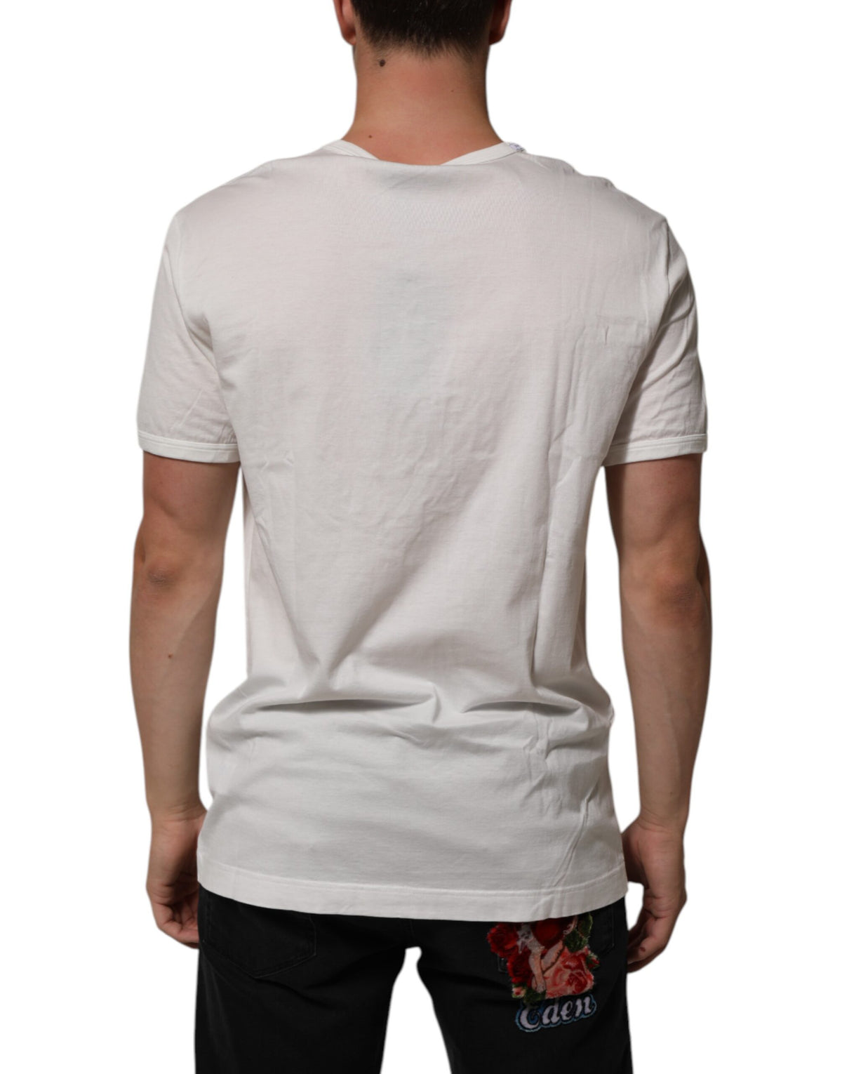 Indulge in the exquisite Dolce & Gabbana White Cotton DG Crown Embossed T-shirt, where Italian craftsmanship meets timeless elegance, perfect for the discerning individual.