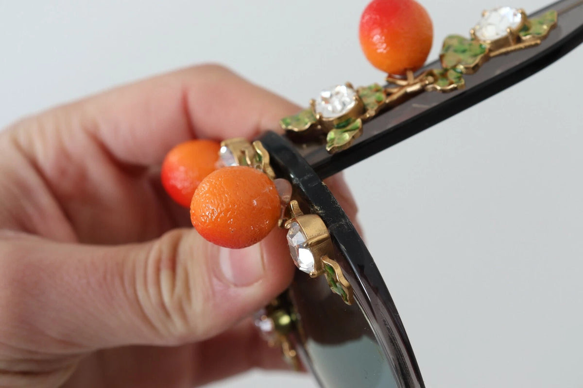 Indulge in the exquisite allure of Dolce & Gabbana DG4283B sunglasses, where luxurious acetate and intricate orange appliques elevate your style to new heights of sophistication.