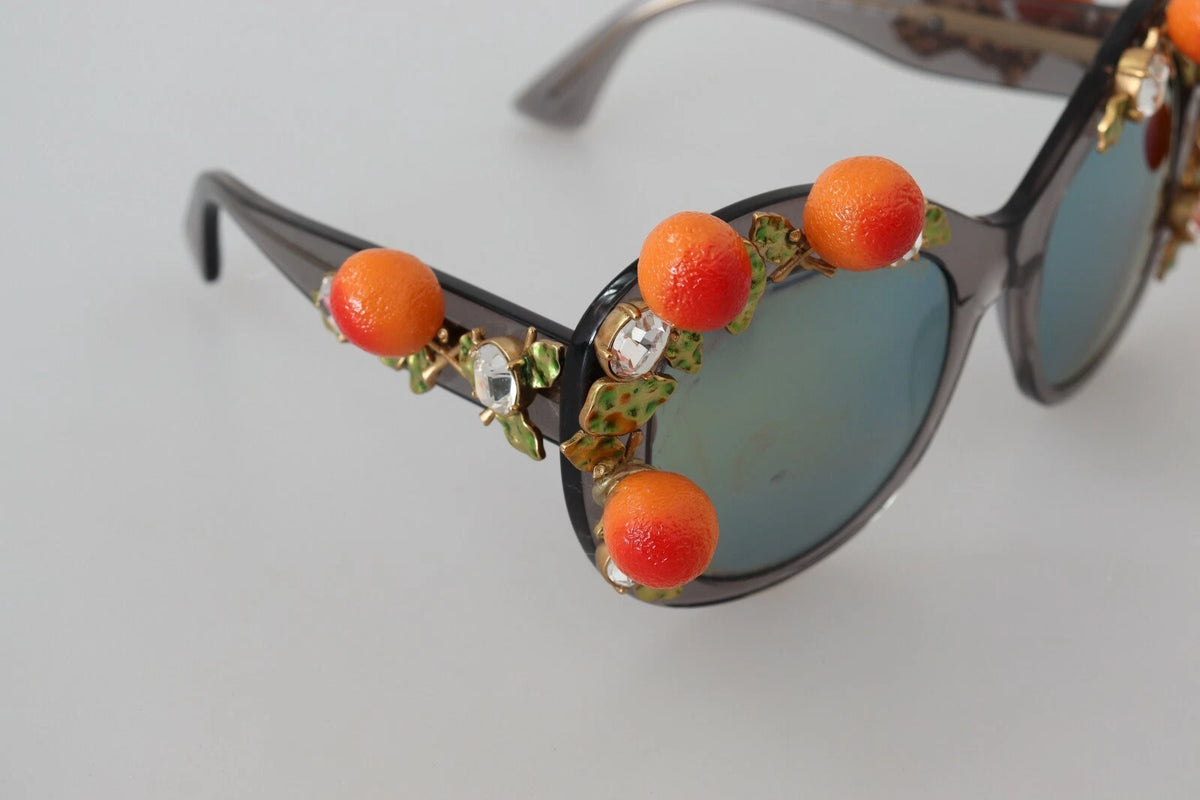 Indulge in the exquisite craftsmanship of Dolce & Gabbana DG4283B sunglasses, where luxurious acetate and intricate orange appliques elevate your style to new heights.