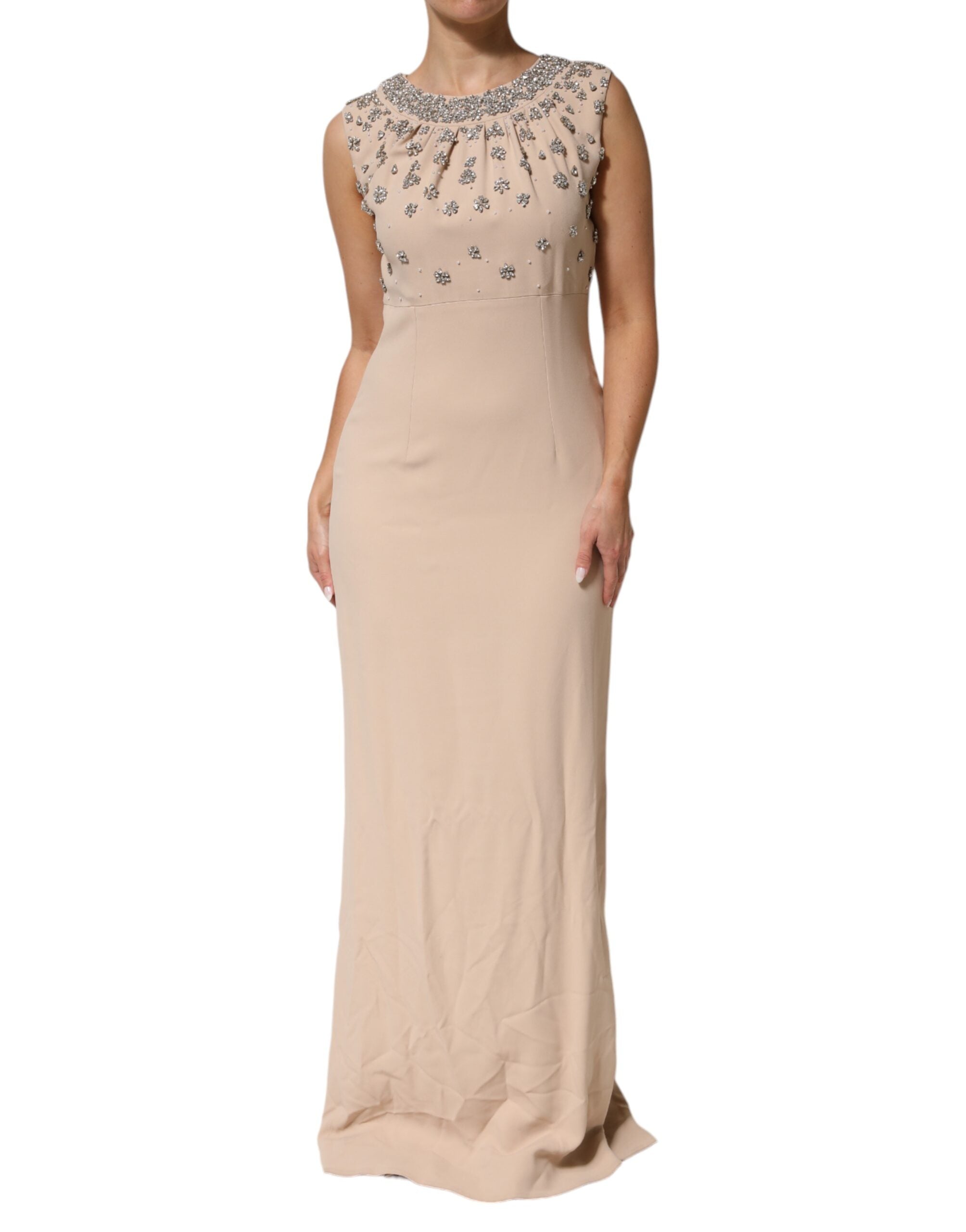 Indulge in the exquisite allure of the Dolce & Gabbana Nude Ecru Beaded Crystal Embellished Dress, a masterpiece of haute couture craftsmanship that radiates elegance and sophistication.
