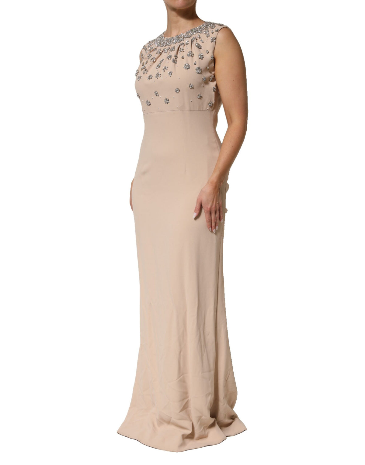 Indulge in the exquisite allure of the Dolce & Gabbana Nude Ecru Beaded Crystal Embellished Dress, a masterpiece of haute couture craftsmanship that embodies timeless elegance and sophistication.