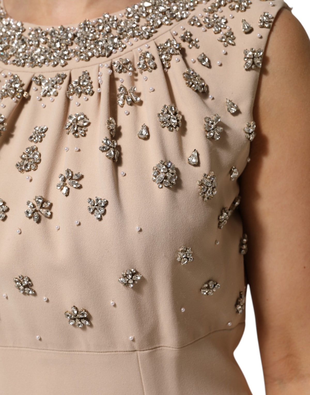 Elevate your elegance with the Dolce & Gabbana Nude Ecru Beaded Crystal Embellished Dress, a masterpiece of Italian craftsmanship that embodies luxury and allure.