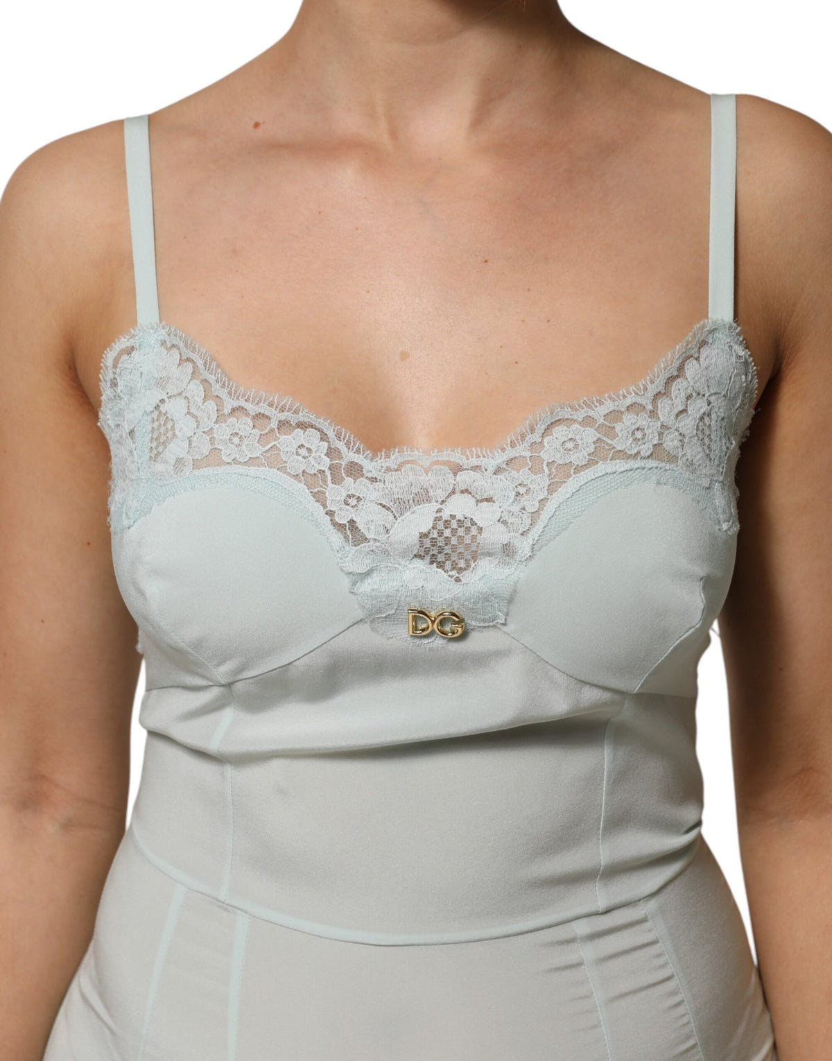 Indulge in the Dolce & Gabbana Light Blue Silk Lace Midi Bodycon Slip Dress, a luxurious blend of silk and lace that embodies timeless elegance and exquisite craftsmanship.