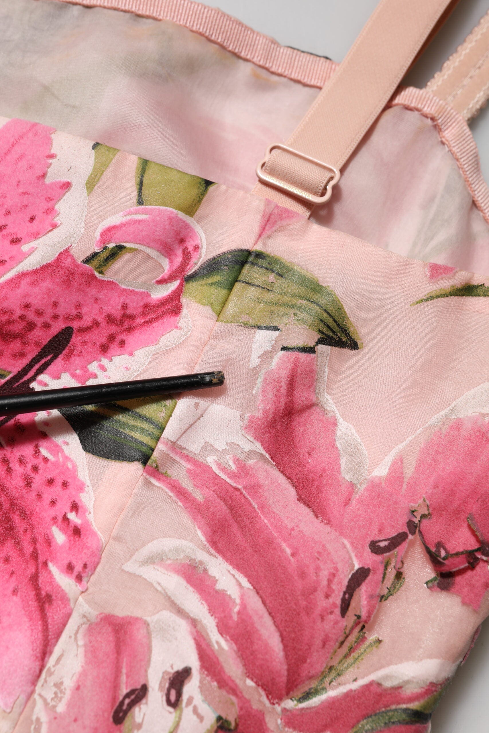 Indulge in the exquisite Dolce & Gabbana Pink Floral Lily Print Midi Dress, a luxurious blend of silk and polyamide, embodying timeless elegance and haute couture craftsmanship.