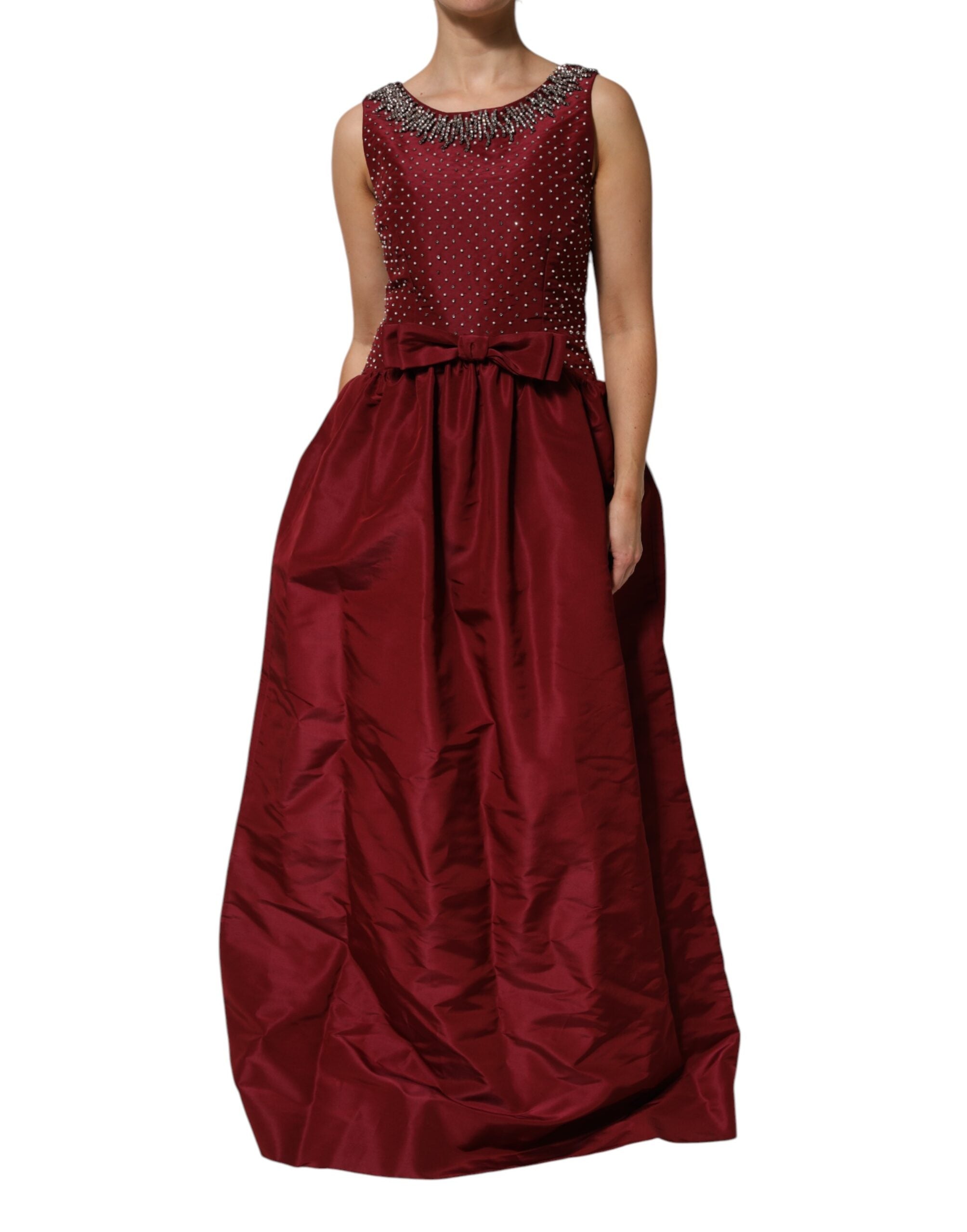 Indulge in the allure of the Dolce & Gabbana Burgundy Silk Beaded Evening Gown, a masterpiece of Italian craftsmanship that embodies elegance and timeless sophistication.