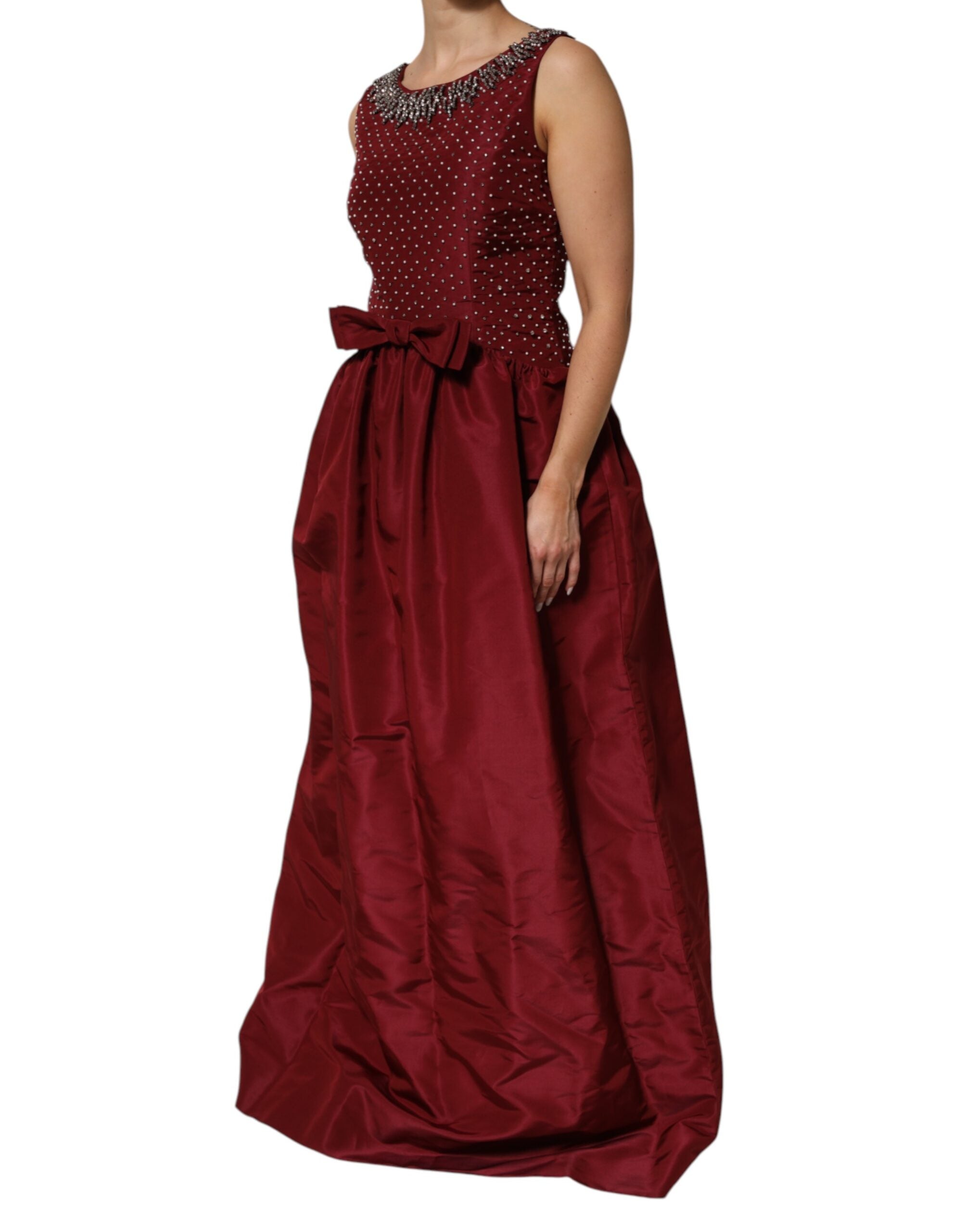 Discover the Dolce & Gabbana Burgundy Silk Beaded Evening Gown, a timeless masterpiece of Italian craftsmanship, blending luxurious silk and intricate beading for an unforgettable allure.