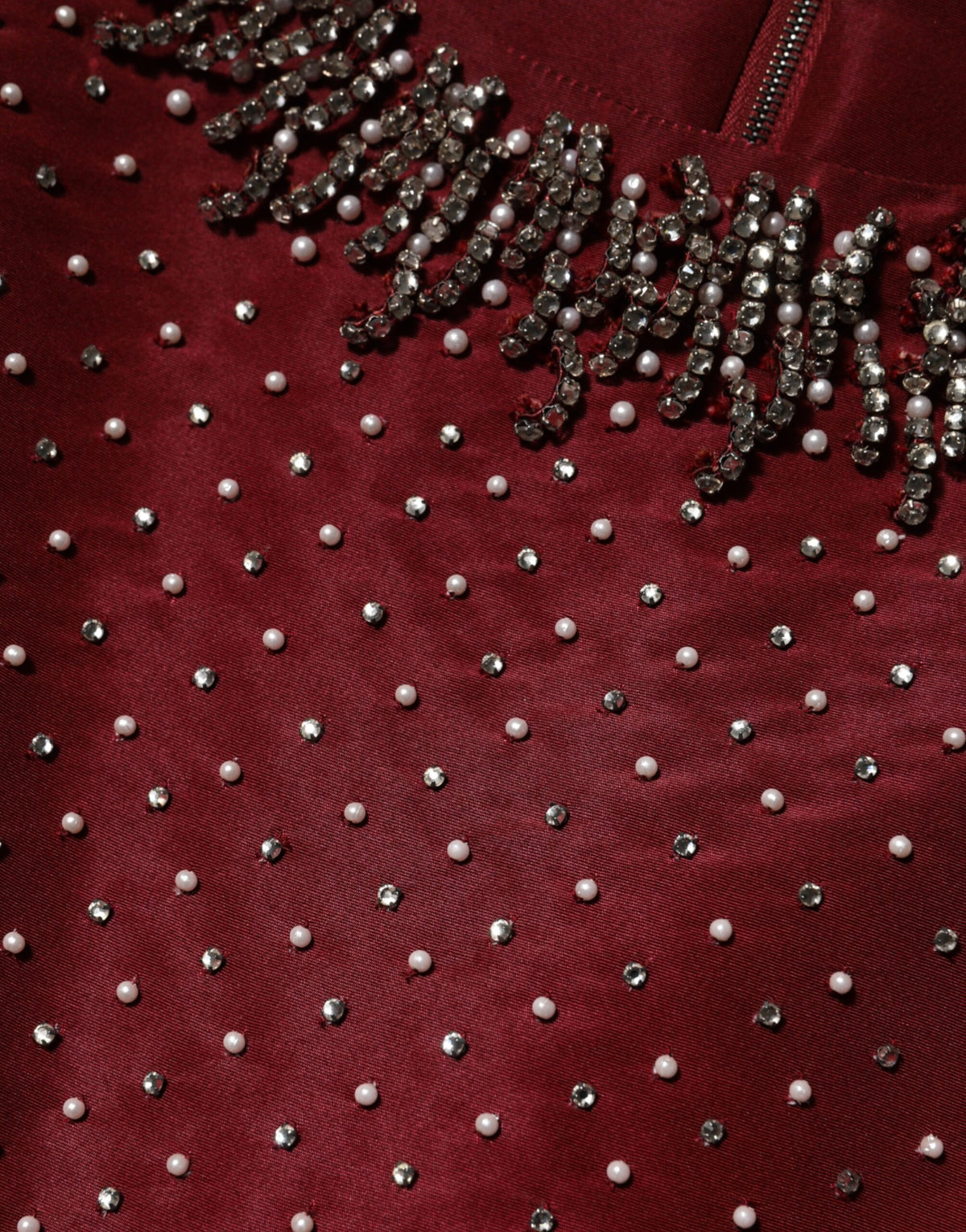 Indulge in the exquisite allure of the Dolce & Gabbana Burgundy Silk Beaded Evening Gown, a masterpiece of Italian craftsmanship that embodies elegance and sophistication.