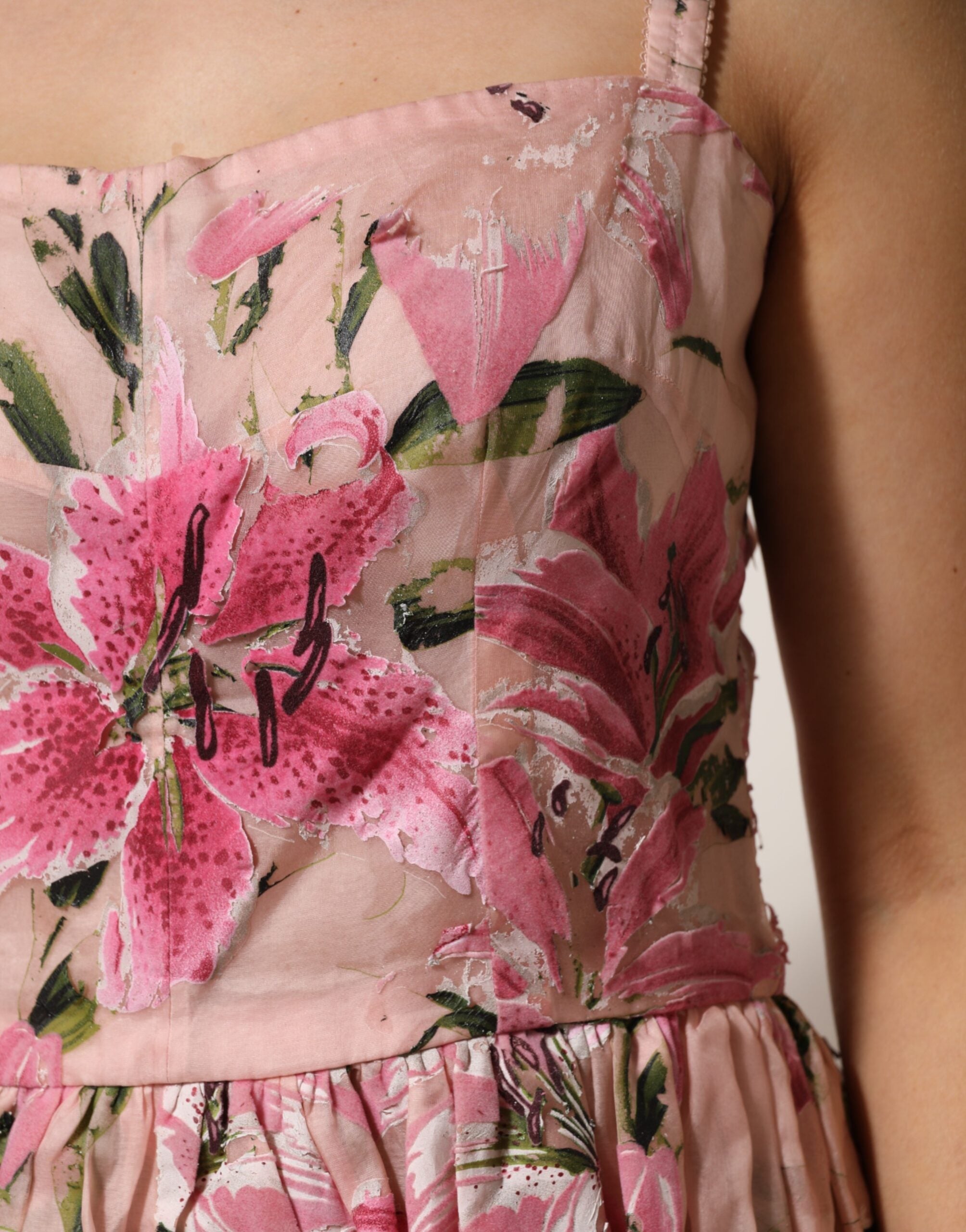 Indulge in the exquisite Dolce & Gabbana Pink Cotton Floral Pleated Sleeveless Dress, a timeless piece of Italian haute couture that embodies elegance and sophistication.
