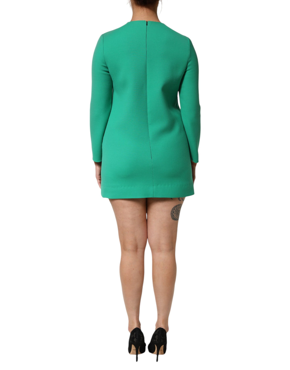 Indulge in the exquisite allure of the Dolce & Gabbana Green Viscose Acetate Mini Long Sleeve Dress, where luxurious craftsmanship meets vibrant elegance for the discerning individual.