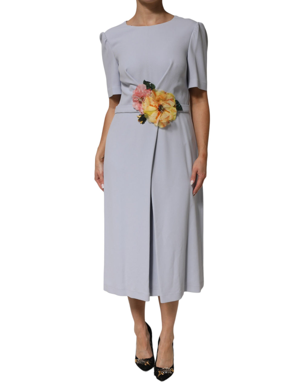 Indulge in the exquisite allure of the Dolce & Gabbana Light Blue Viscose Blend Floral Applique Dress, where artisanal craftsmanship meets romantic elegance for unforgettable moments.