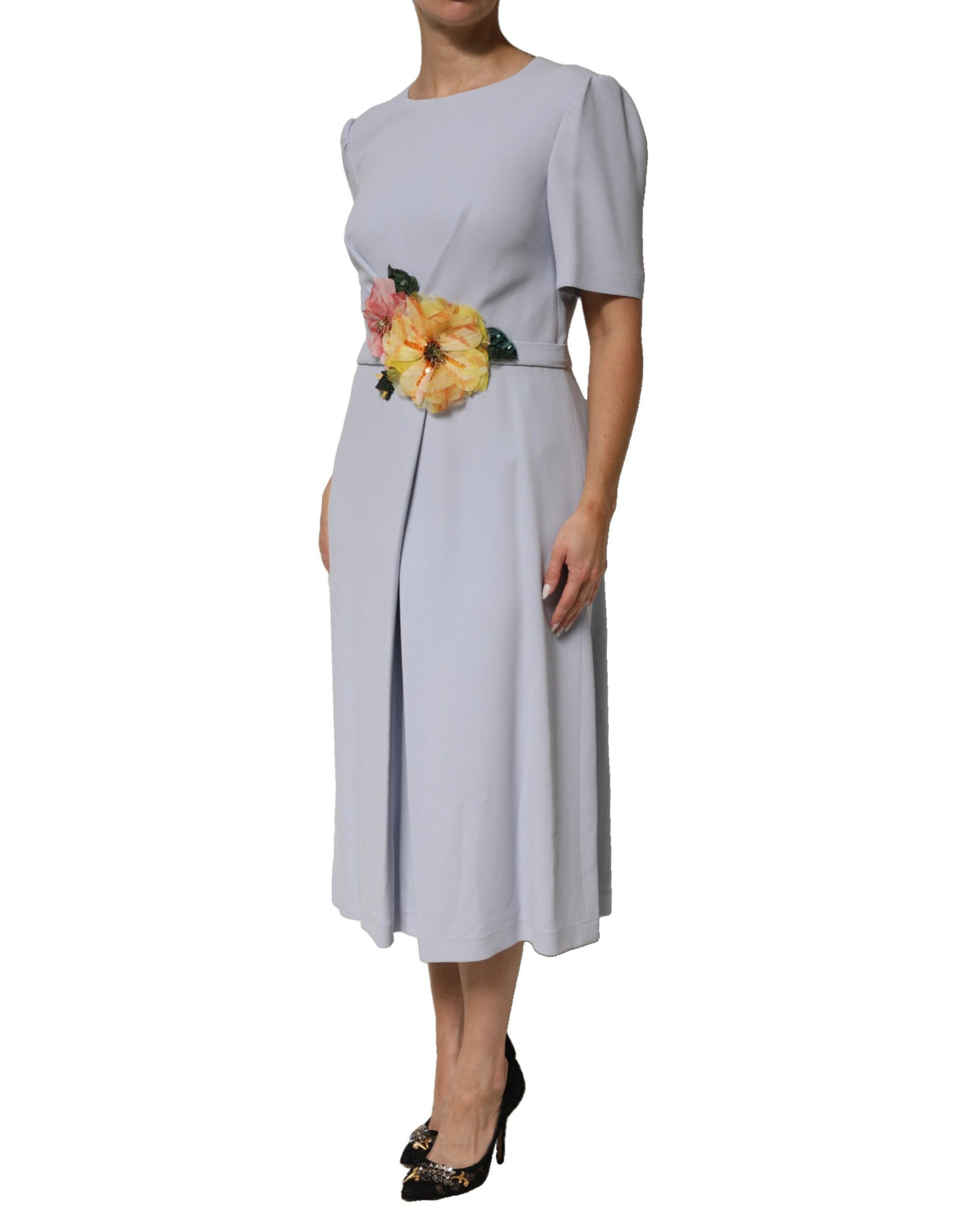 Indulge in the exquisite allure of the Dolce & Gabbana Light Blue Viscose Blend Floral Applique Dress, where artisanal craftsmanship meets romantic elegance, perfect for unforgettable moments.