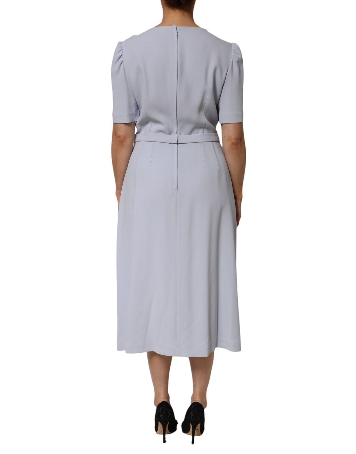 Indulge in the exquisite Dolce & Gabbana Light Blue Viscose Blend Floral Applique Dress, a timeless piece that embodies romantic luxury and artisanal elegance, crafted in Italy.