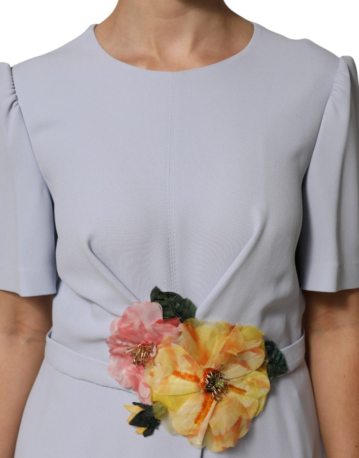Indulge in the exquisite Dolce & Gabbana Light Blue Viscose Blend Floral Applique Dress, where luxurious craftsmanship meets romantic elegance, perfect for unforgettable moments.