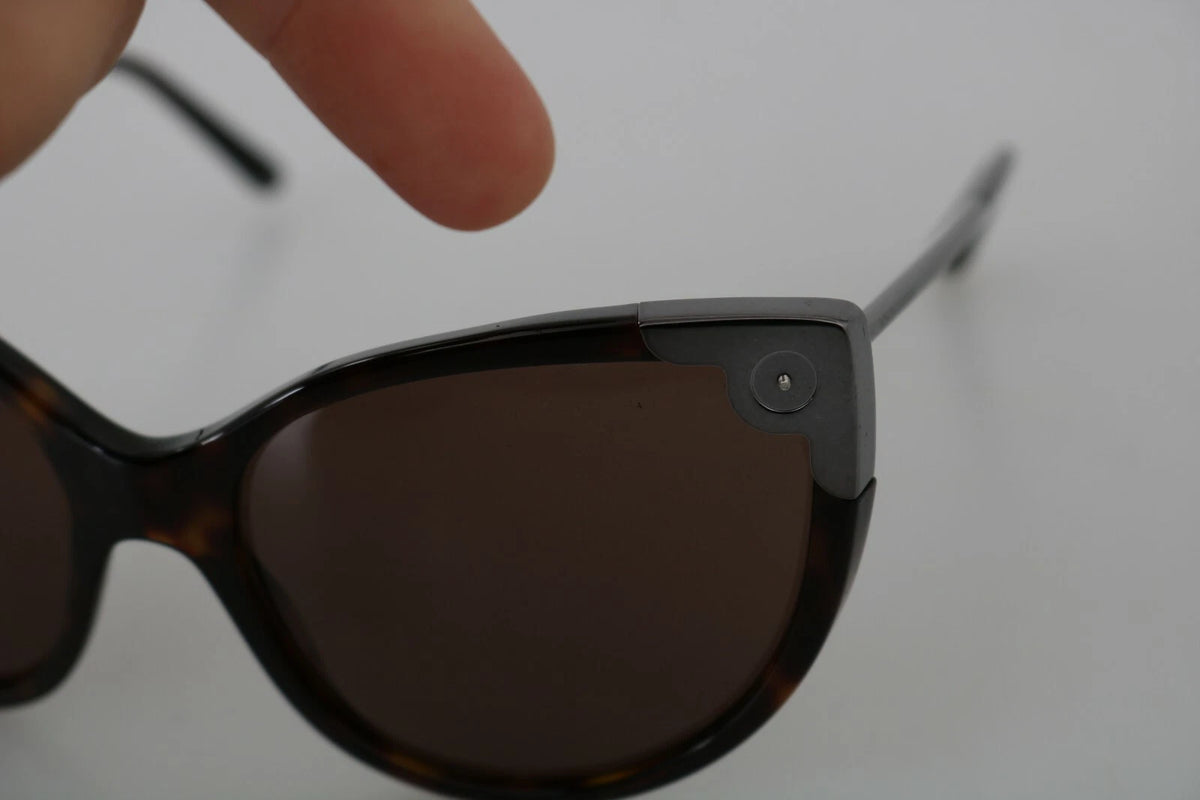 Indulge in the exquisite Dolce & Gabbana DG4337 Dark Havana Cat Eye Sunglasses, where Italian craftsmanship meets timeless elegance, perfect for elevating any ensemble.